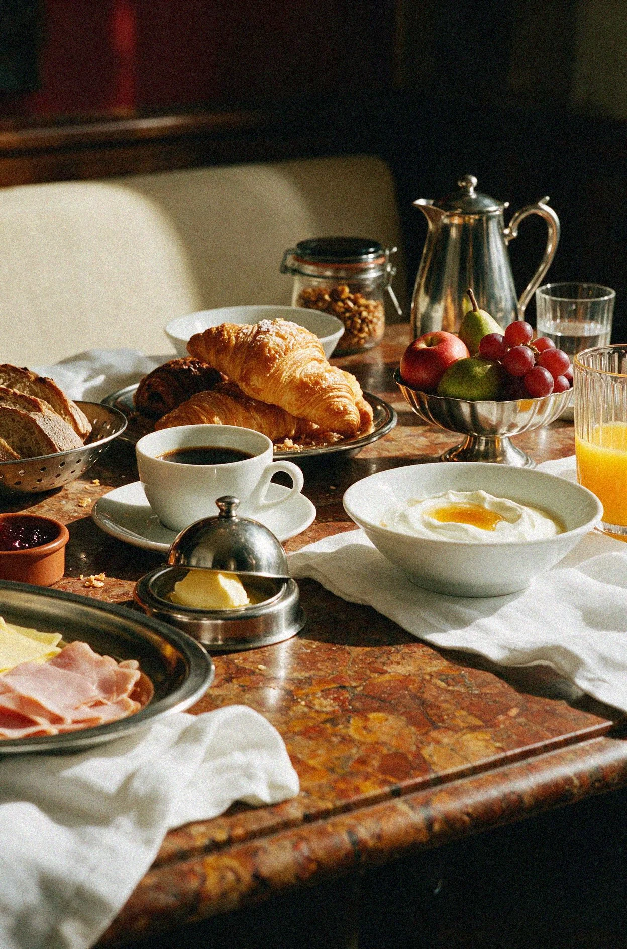 Laplace breakfast: coffee, pastries, bread, fruit, and yogurt