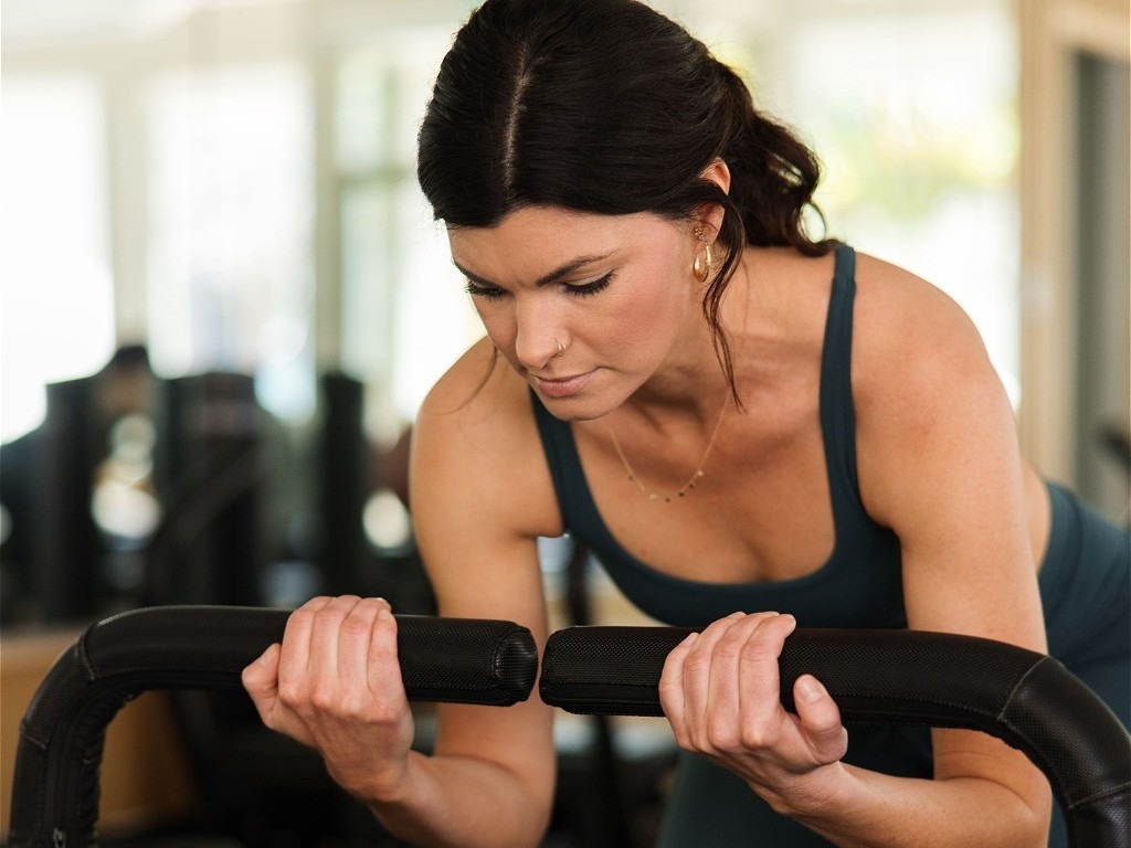 Woman doing chest curl-ups