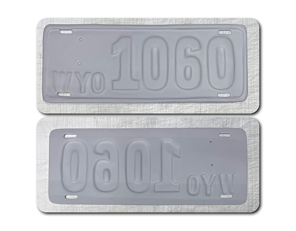 Two white embossed Maryland license plates from 1931 with the number 3-712.