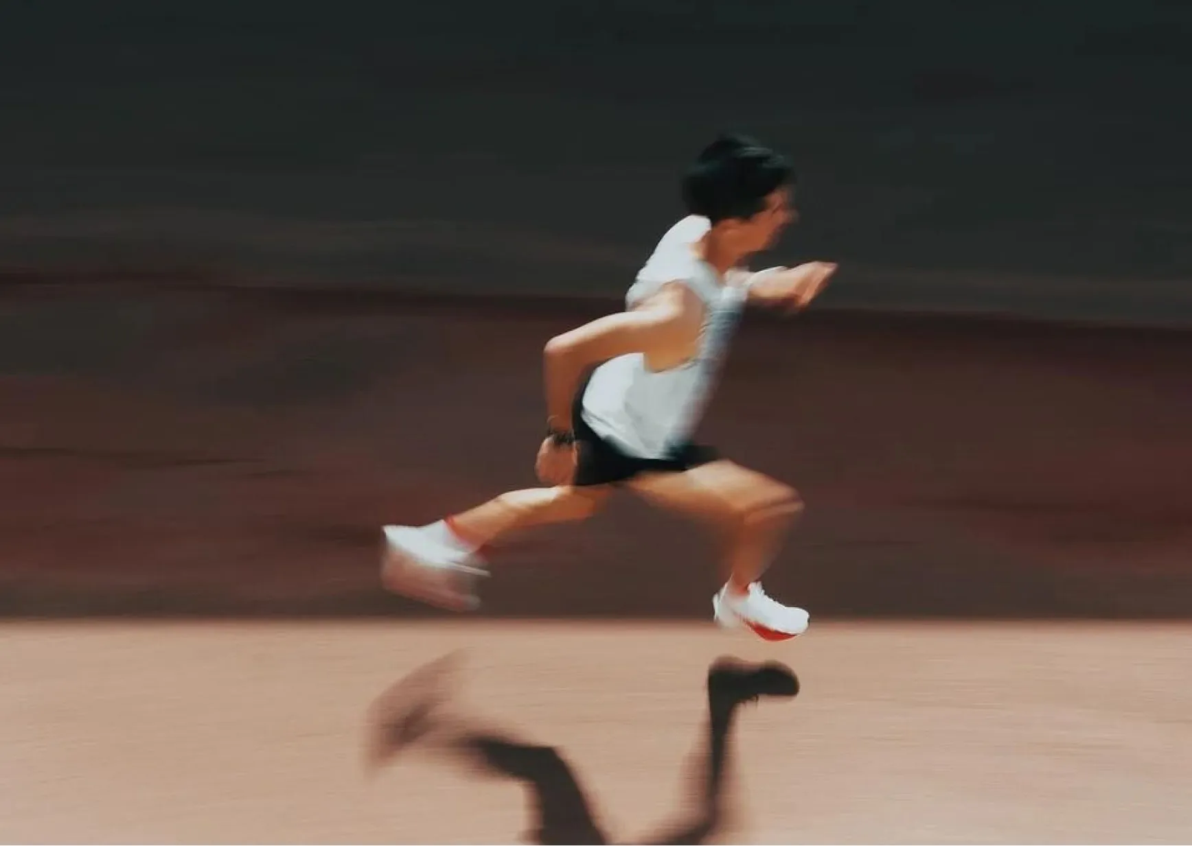 Executive running outdoors in the morning to improve energy, endurance and daily performance.