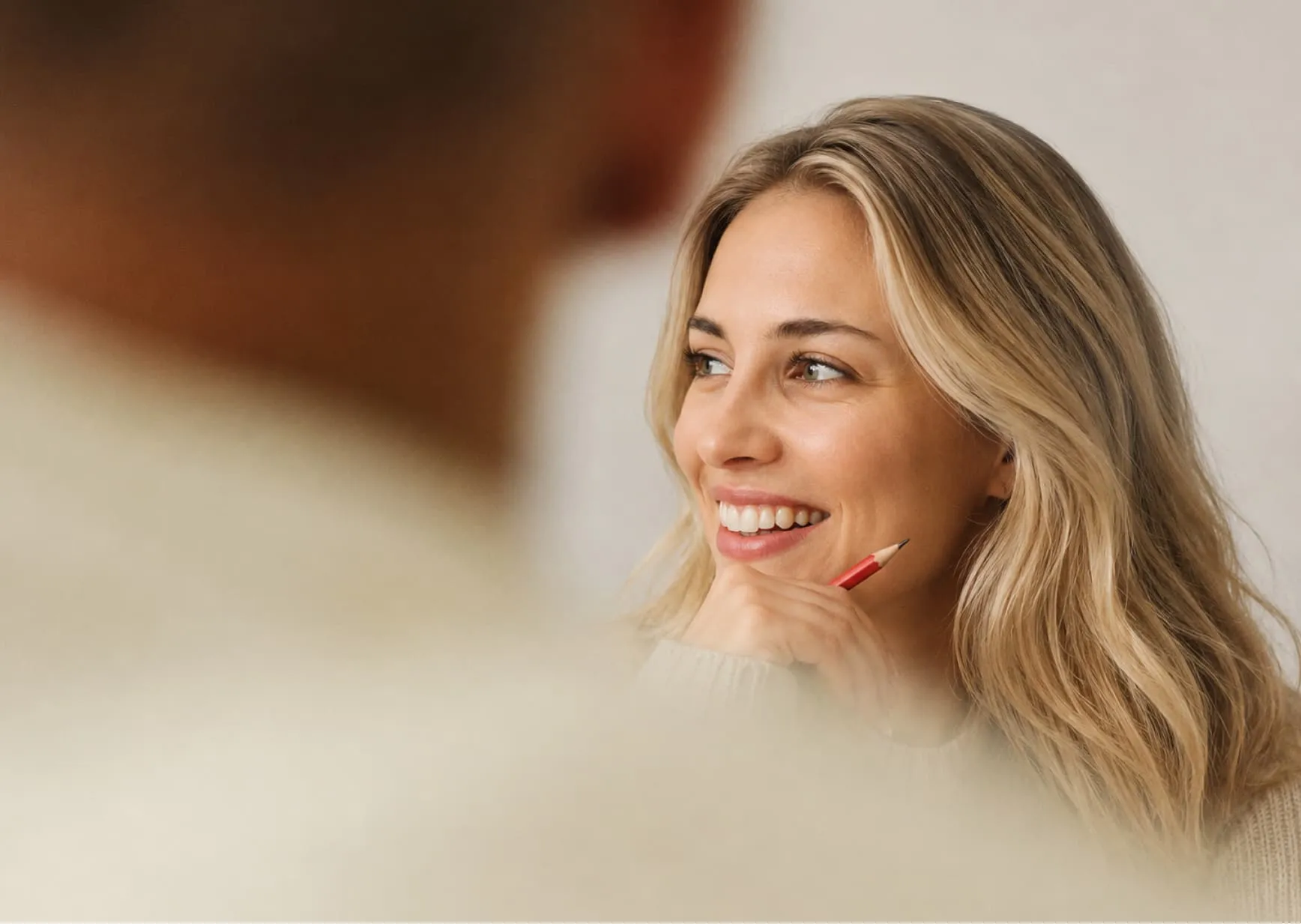 Smiling woman during a consultation symbolising improved mood, motivation and emotional wellbeing.