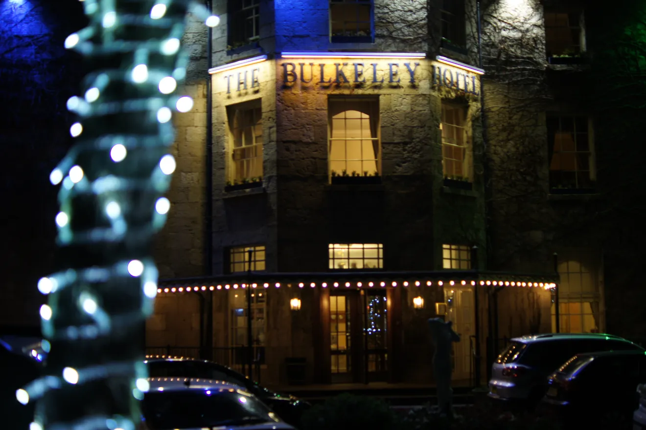 The Bulkeley Hotel lit up with Christmas lights at night in Beaumaris