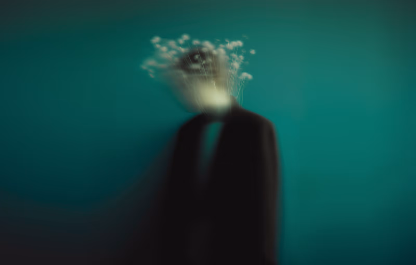 Blurred figure in dark suit with abstract white shapes emerging from head on teal background.