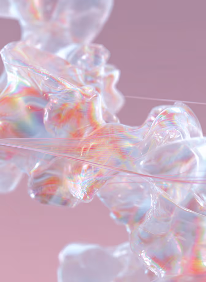Close-up of translucent, wavy, iridescent shapes against a soft pink background.