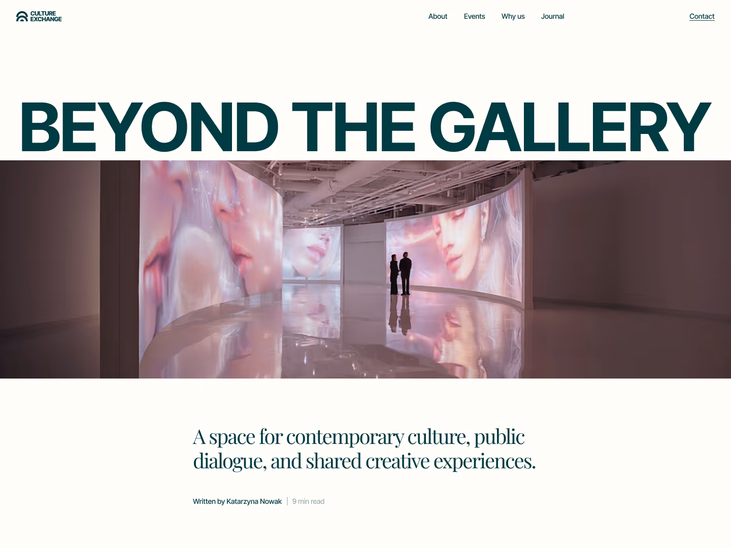 Curved gallery with large digital portraits and two people standing inside reflecting on shiny floor.