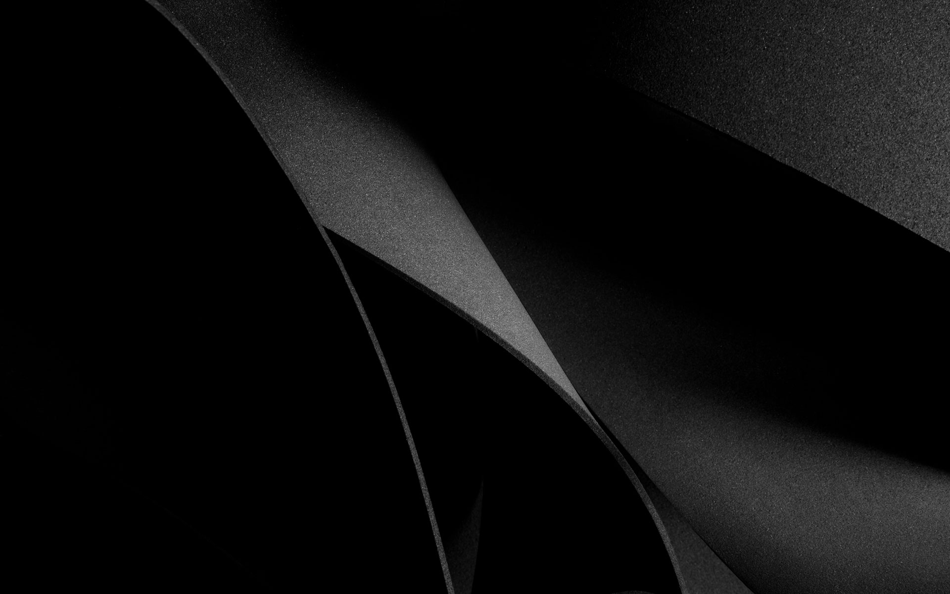 Abstract dark geometric texture representing Sequel Data Systems' brand aesthetic