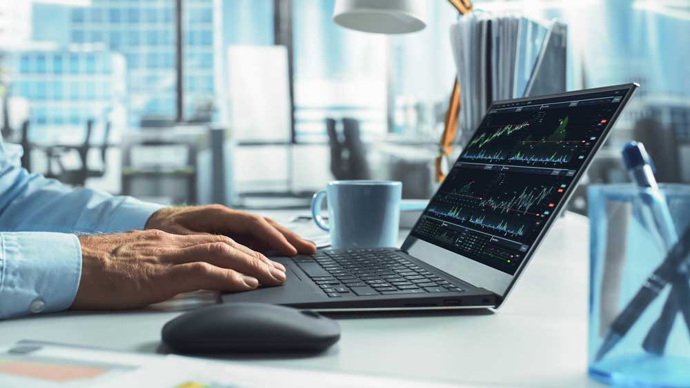 Sequel-Data-Systems-client-reviewing-data-on-a-laptop-dashboard