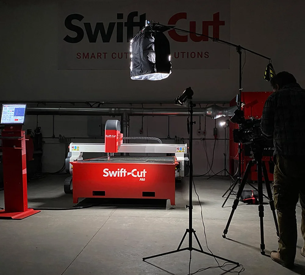 Camera crew filming a Swift-Cut plasma cutting machine