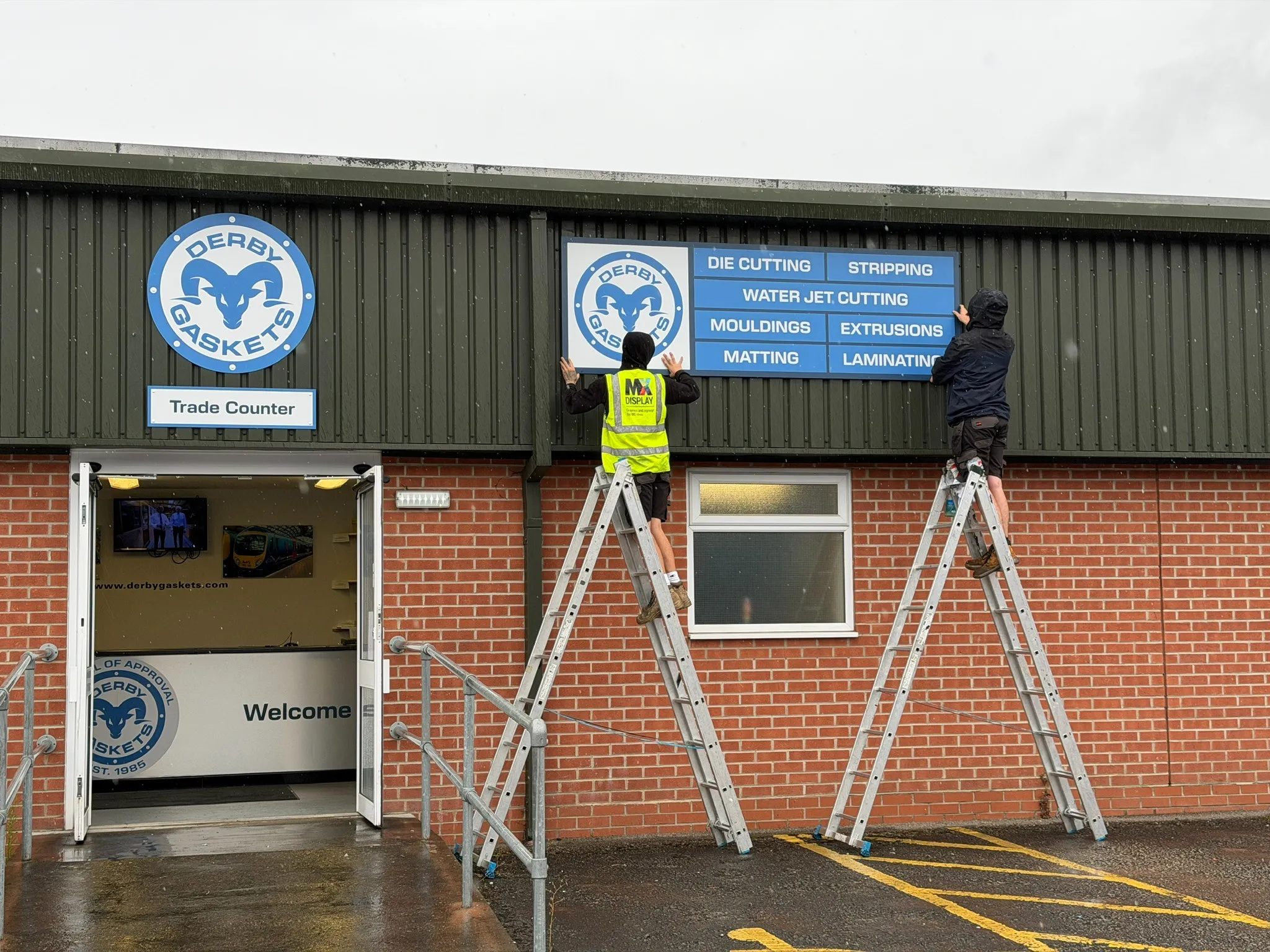 Derby Gaskets signage being installed