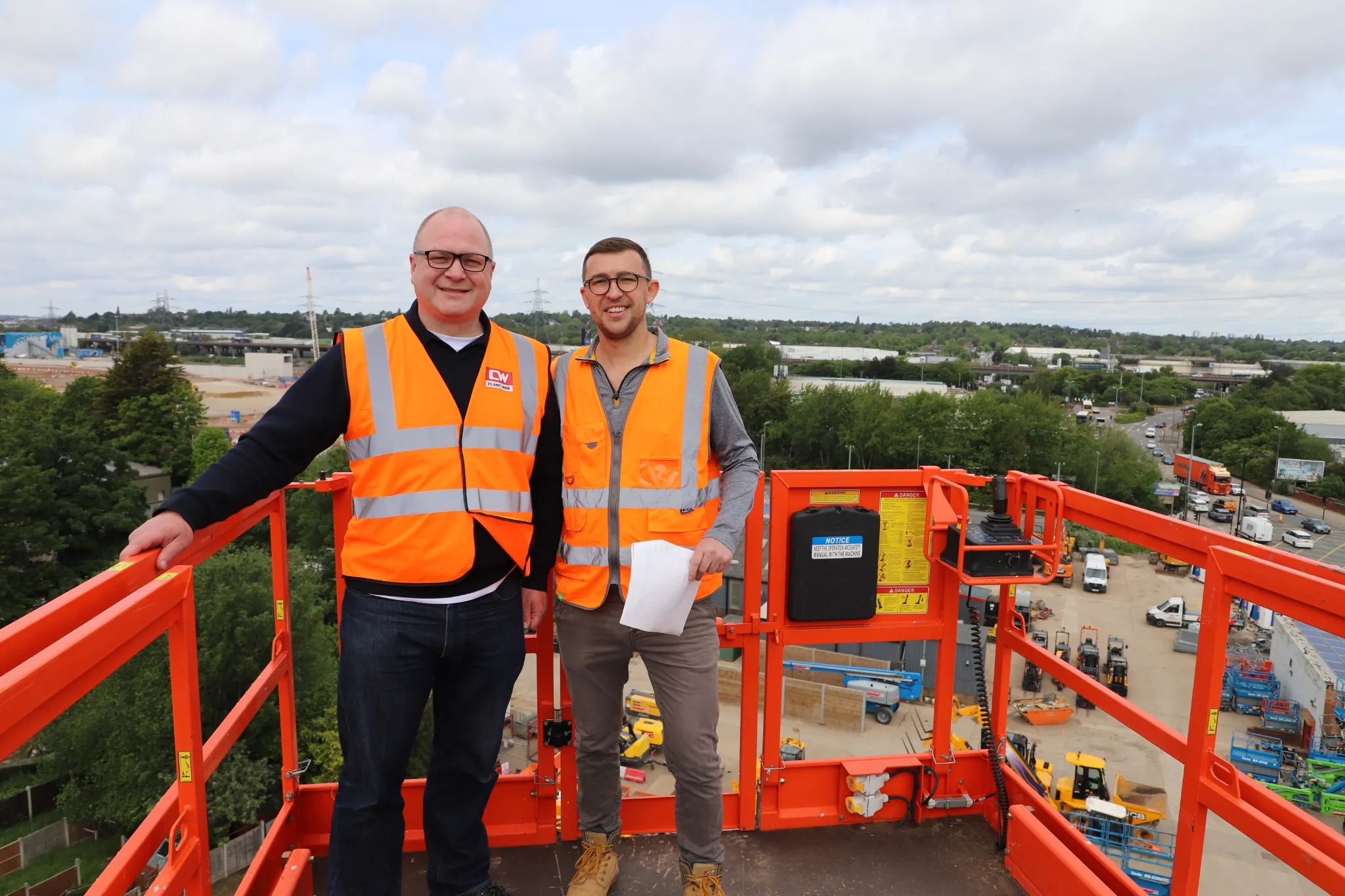 New Era team visiting CW Plant Hire on an access platform