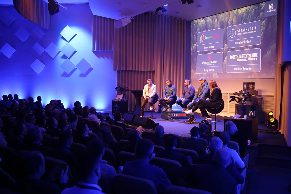 Panel discussion on stage at a Husqvarna conference