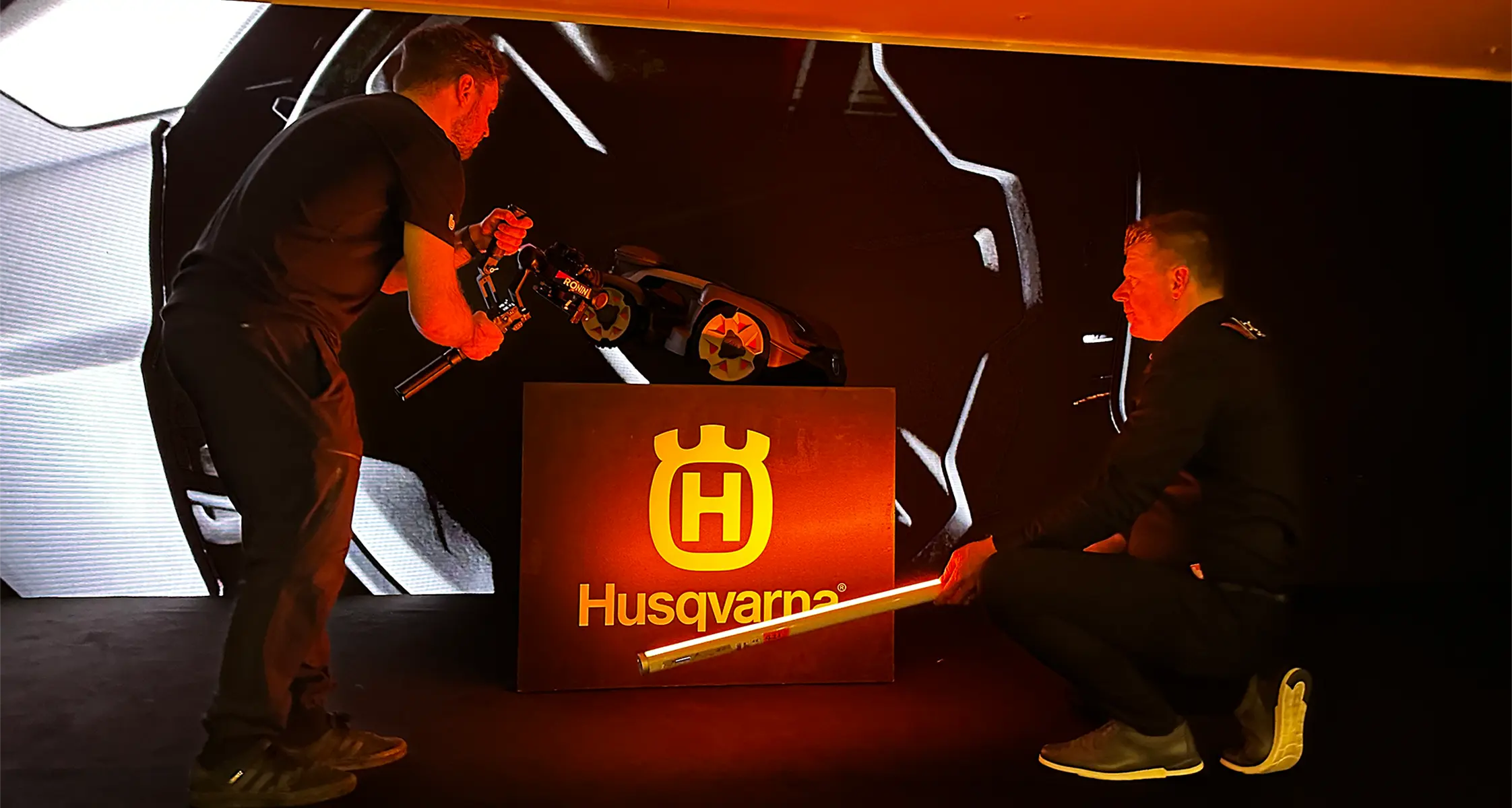 Husqvarna product demonstration on a lit stage set at a launch event