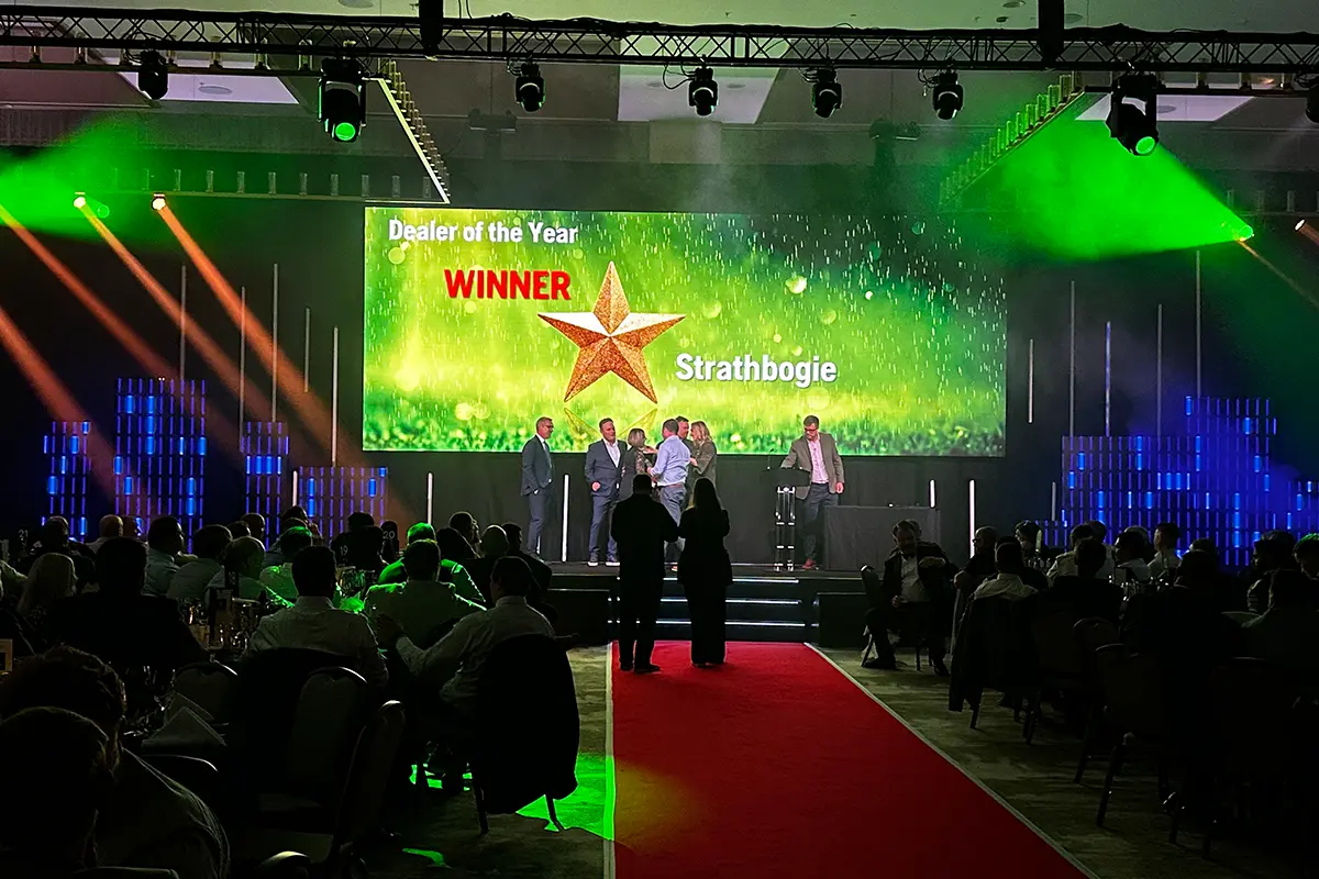 Dealer of the Year award presented on stage at a Husqvarna conference