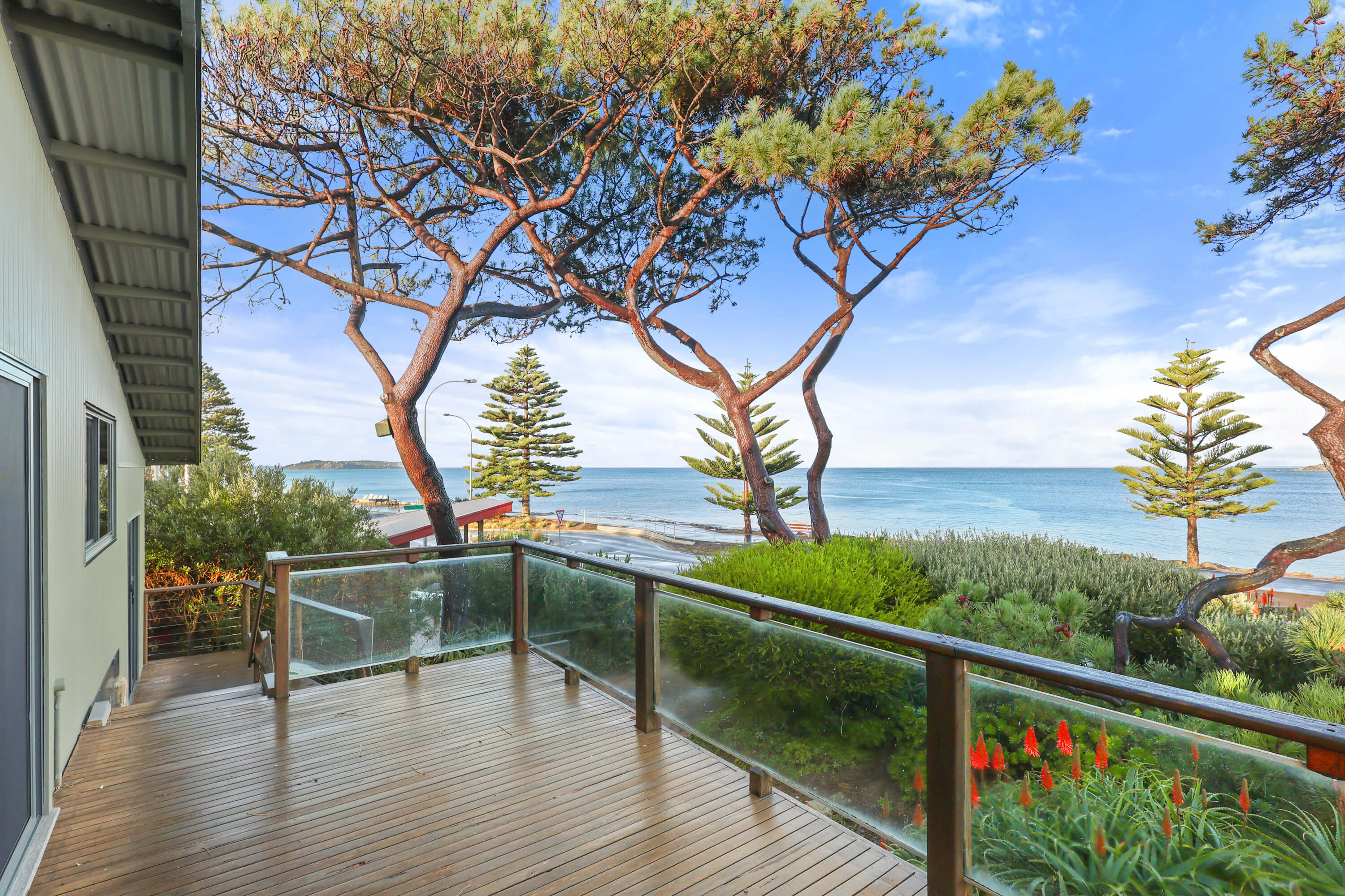 Timber deck with glass and timber balustrade looking over Encounter Bay at Franklin Ave