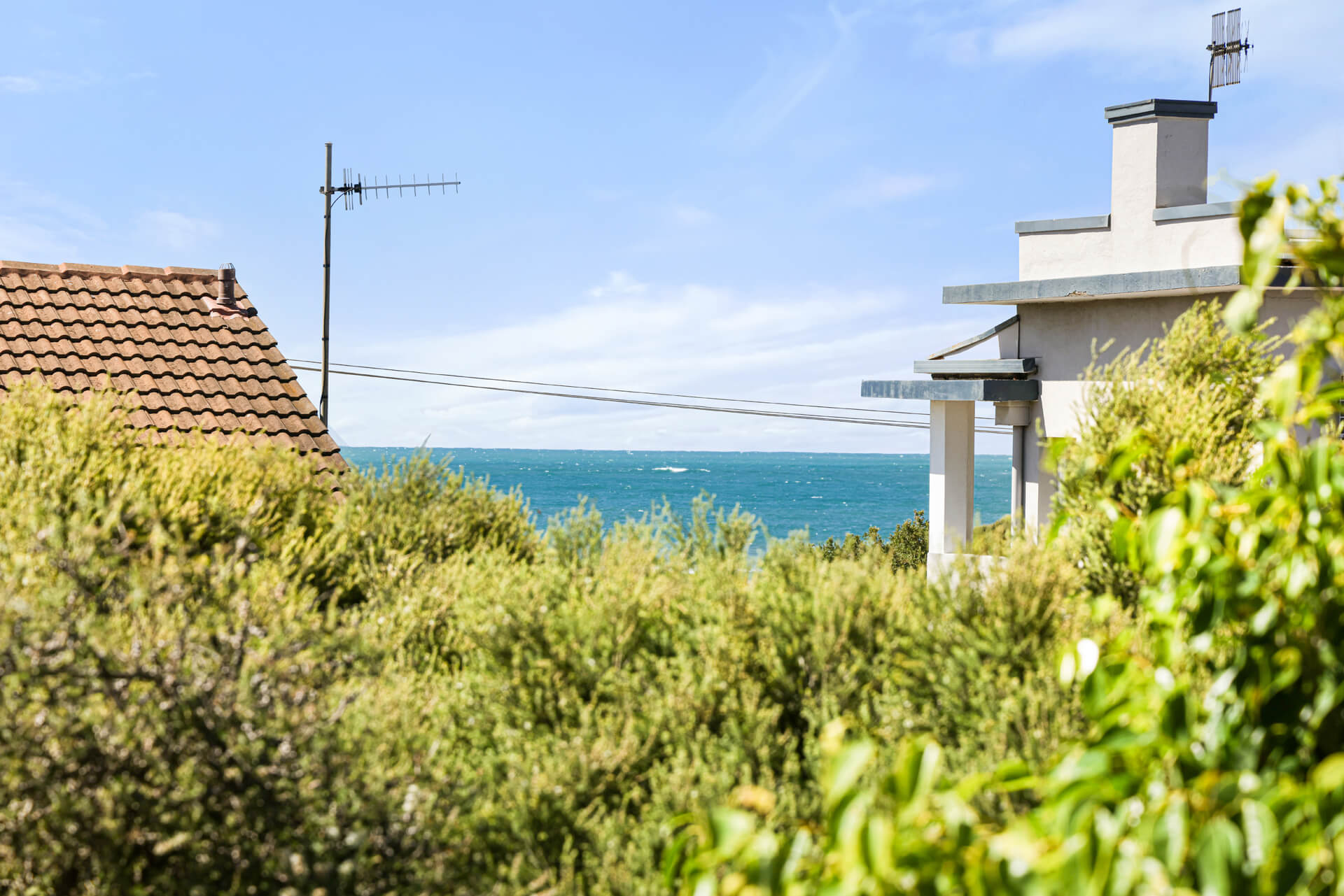View over coastal rooftops to the sea from the Victoria St home, Victor Harbor