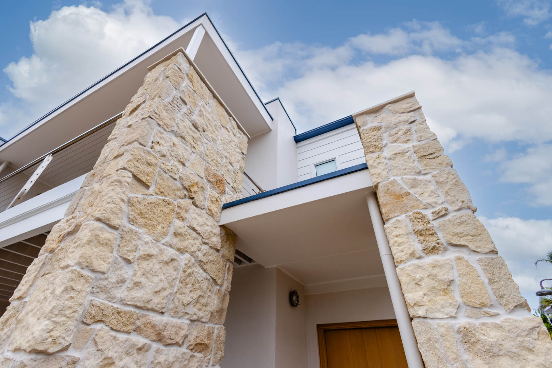 Rough-cut limestone pillars framing the entry of the Henry St home, Port Elliot