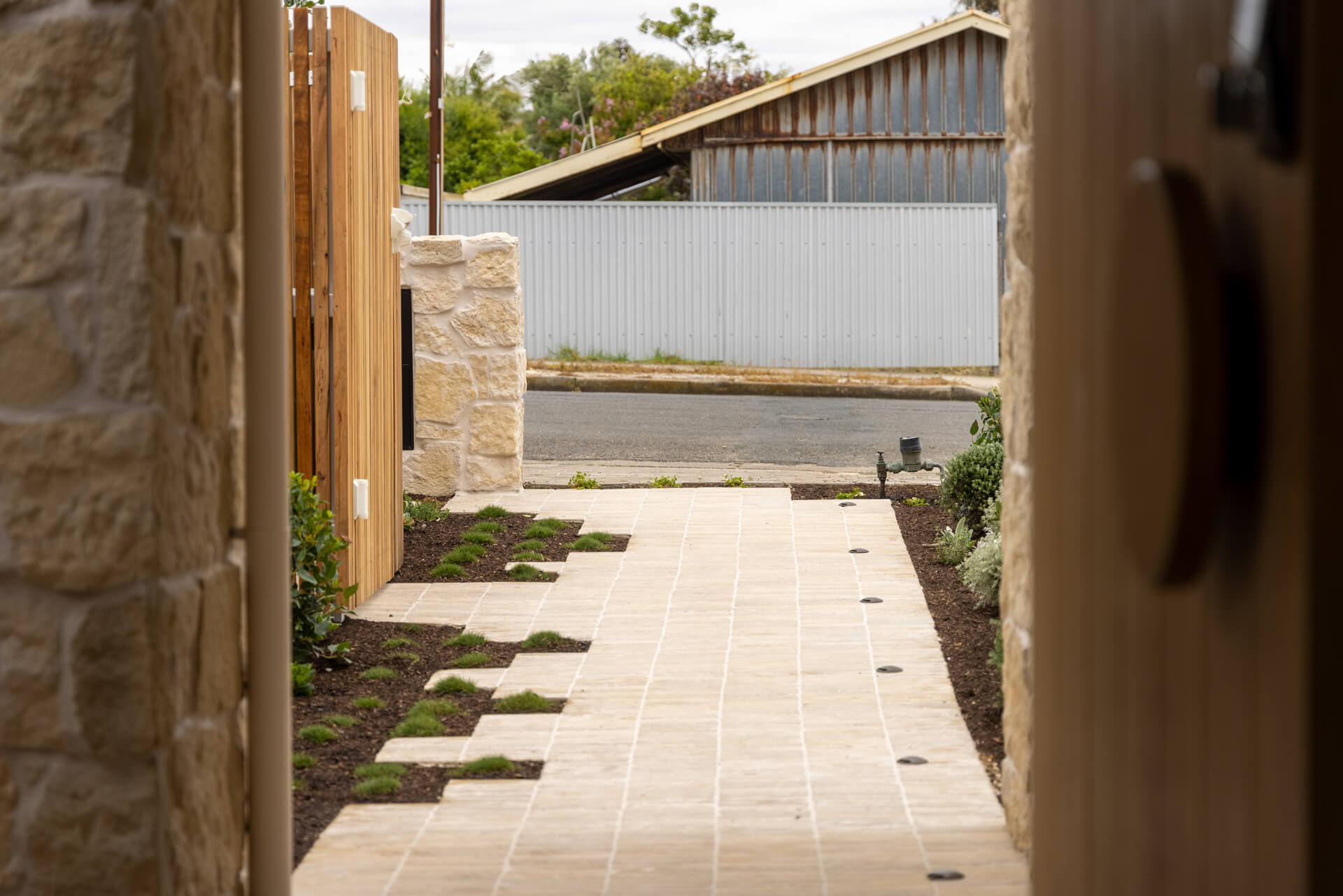 Limestone paved path with inset groundcover joints leading to the entry at Henry St, Port Elliot