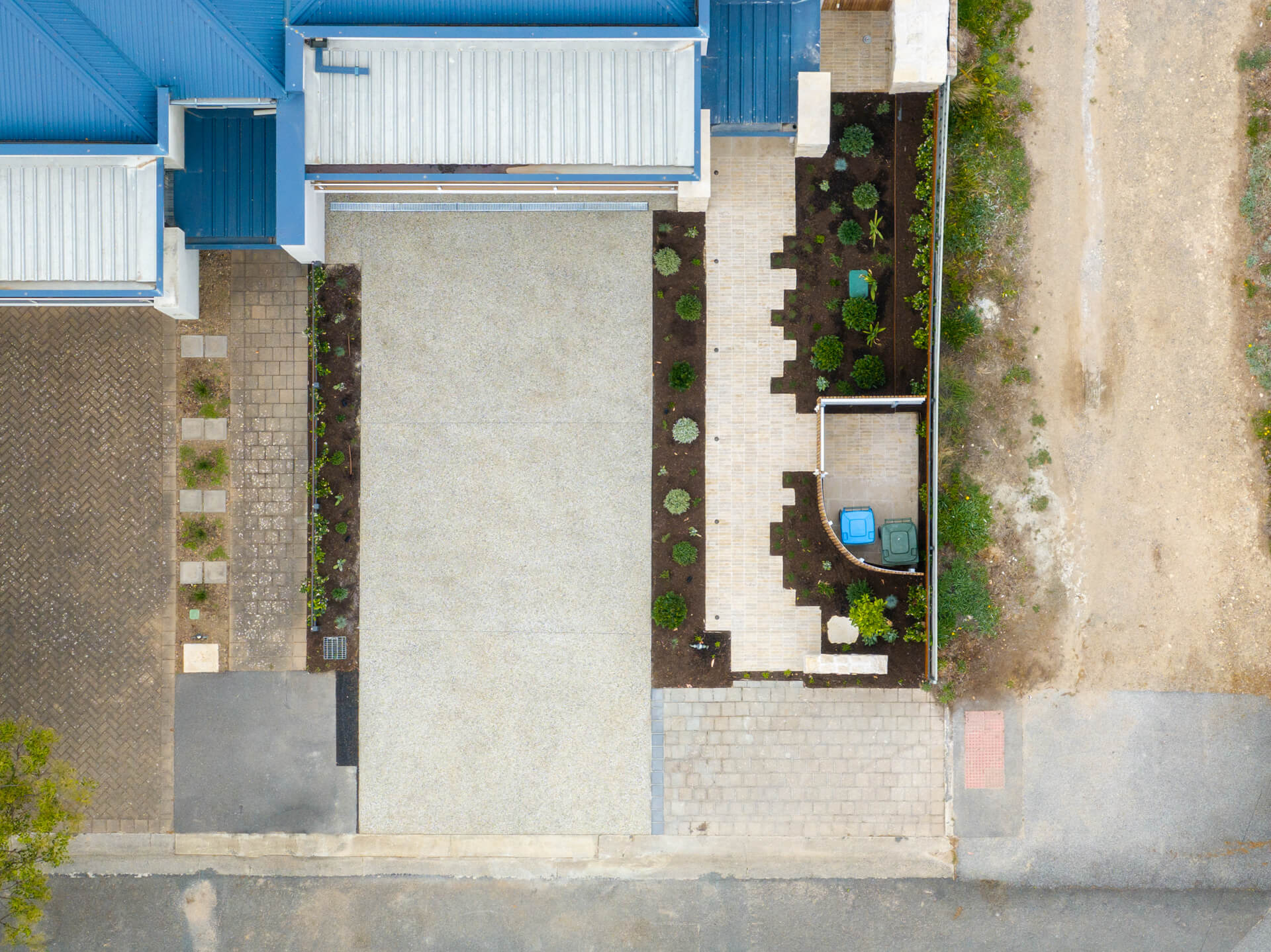 Overhead view of the Henry St backyard with gravel paths, garden beds and paved entertaining area, Port Elliot