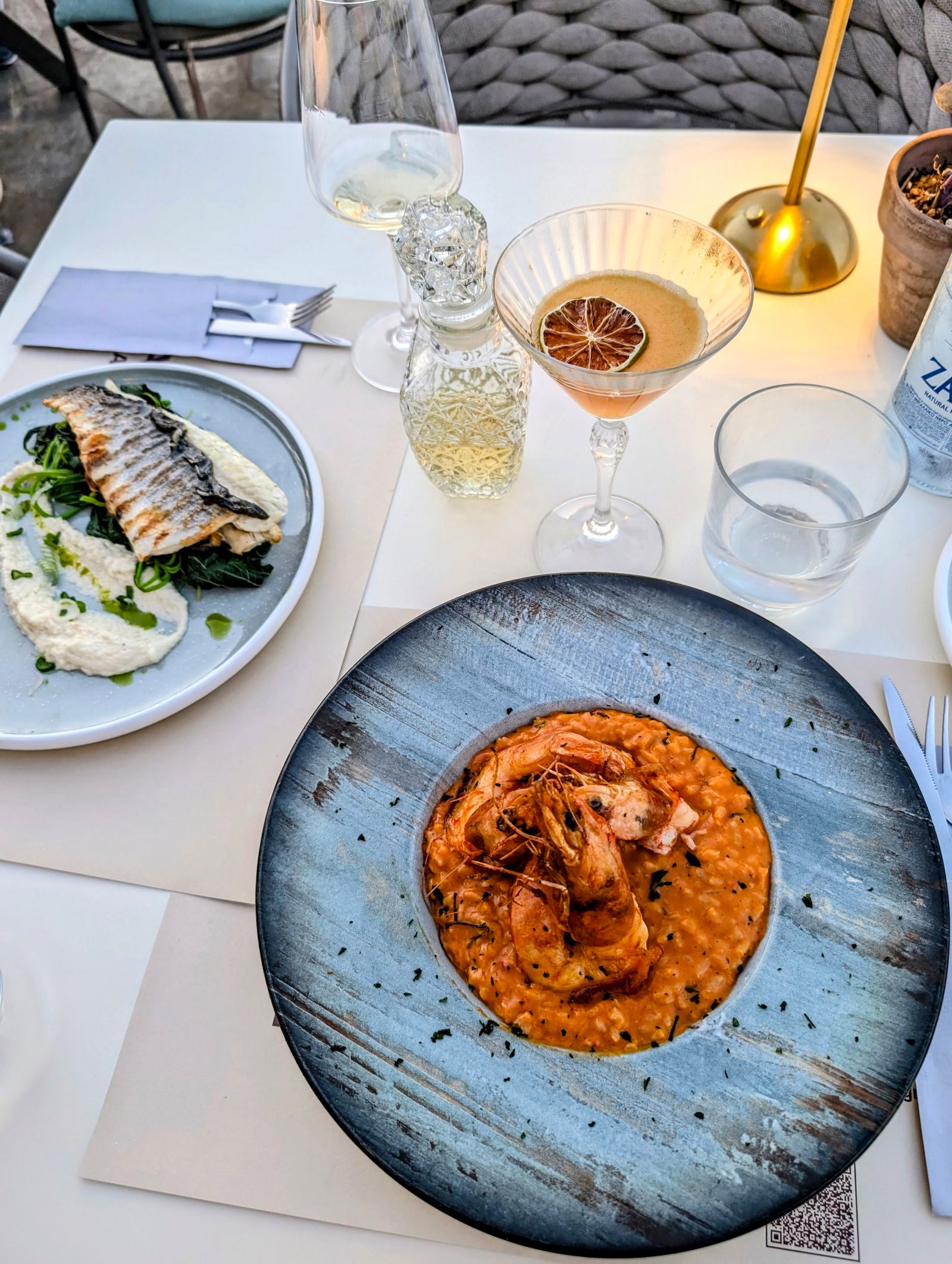 Shrimp risotto and white wine by the sea on Samos