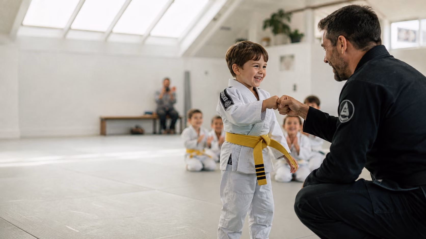Martial arts instructor with a young student during class check-in