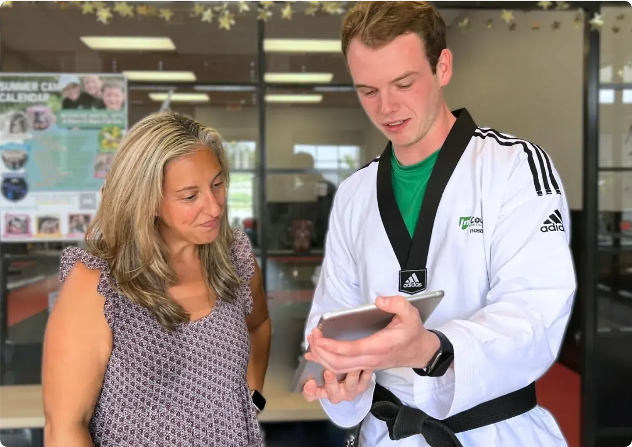 Martial arts instructor working with a student