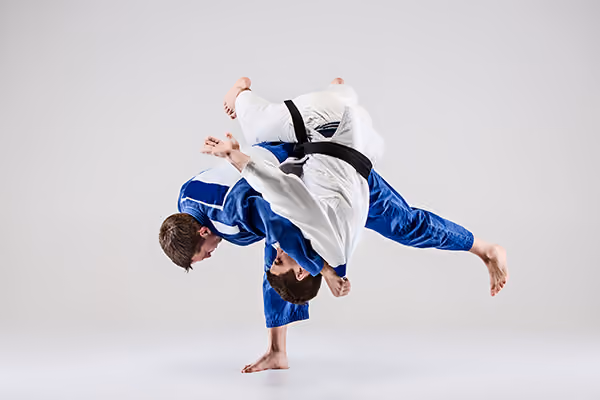 Two judoka fighting during a judo match