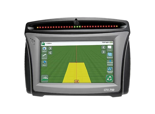Screen of an agricultural GPS navigation device with a field map and guidance line for precision farming in a tractor cabin.