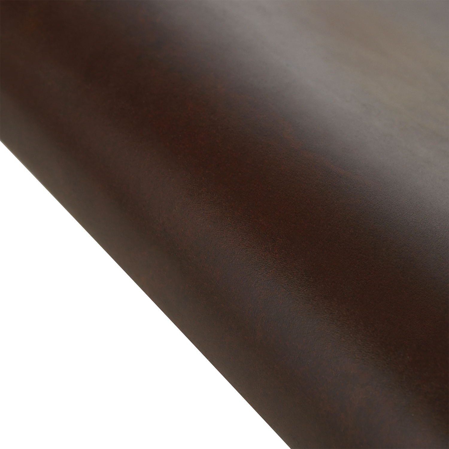 Close-up of a brown leather desk mat showing the finished leather surface