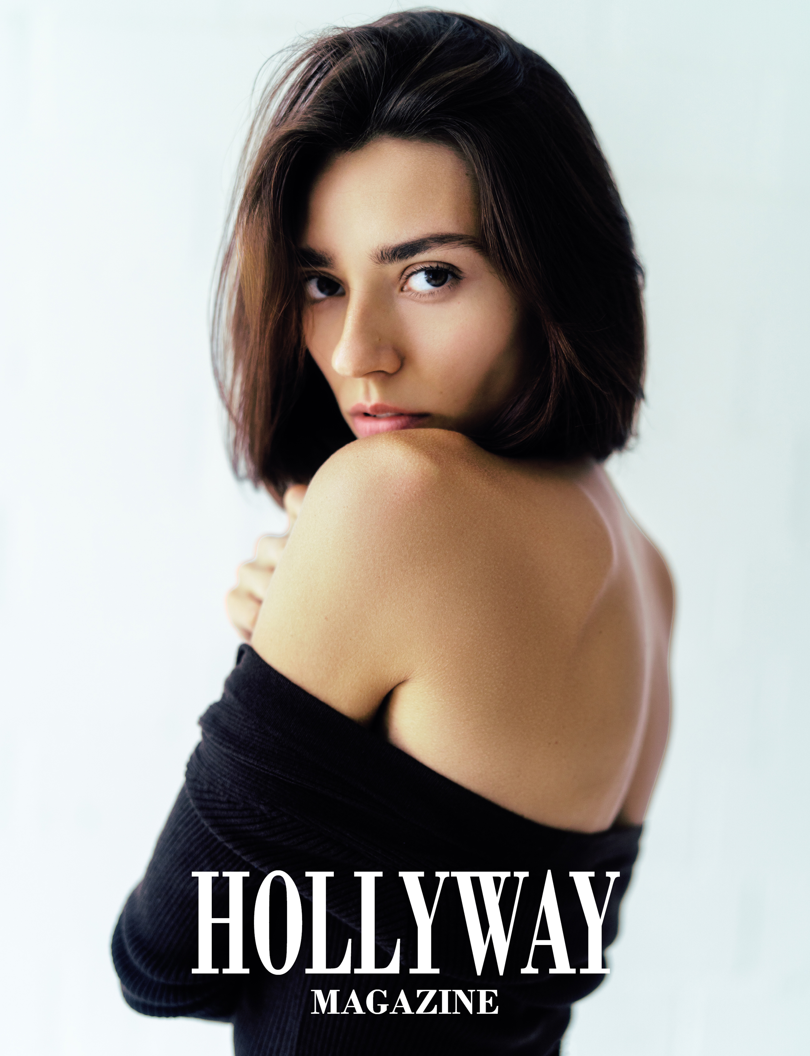 Close-up editorial portrait of a woman wrapped in black fabric for the Velvet Noir series published in HOLLYWAY Magazine.