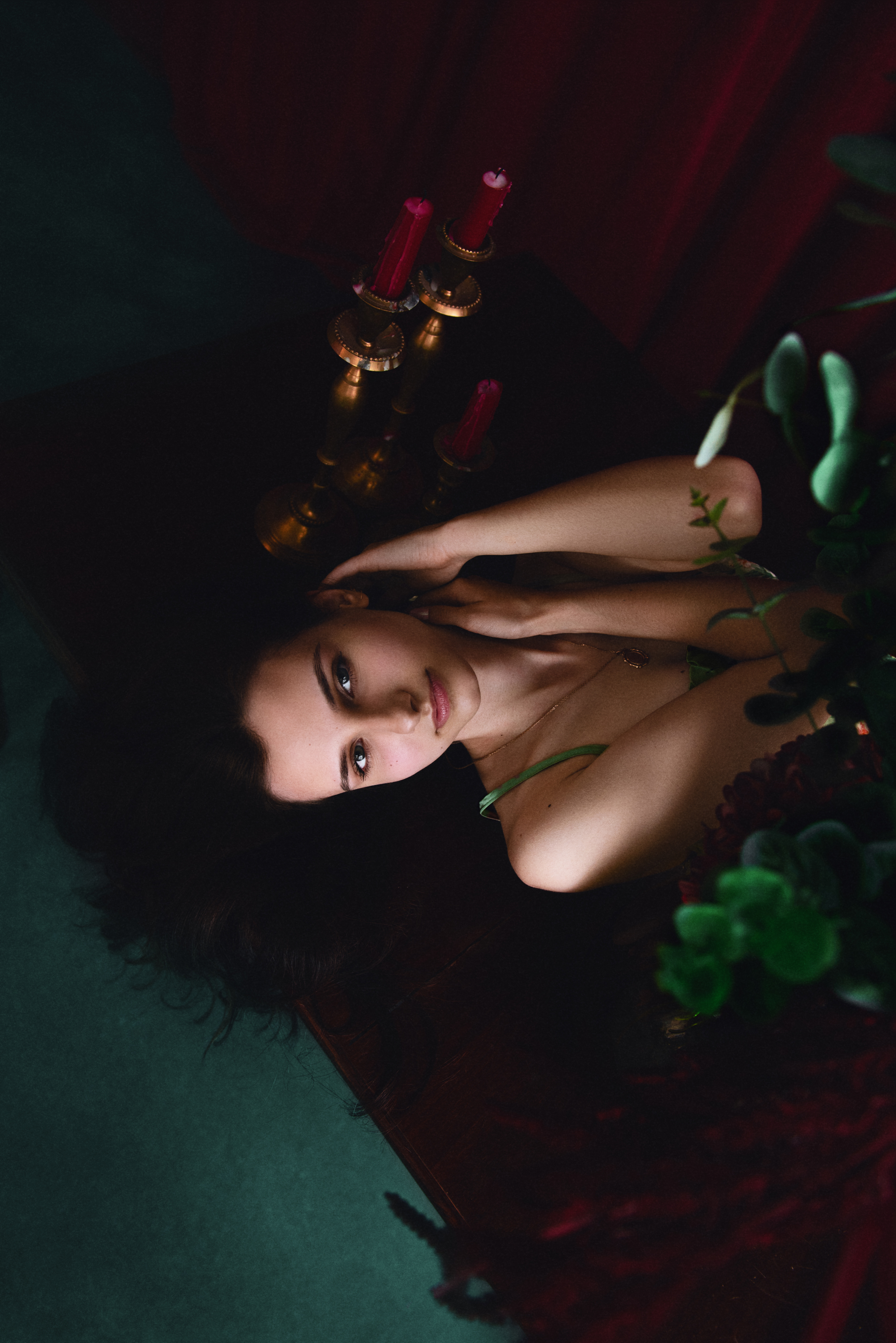 Retouched overhead portrait with refined skin, deeper color and balanced green and red tones across the scene.