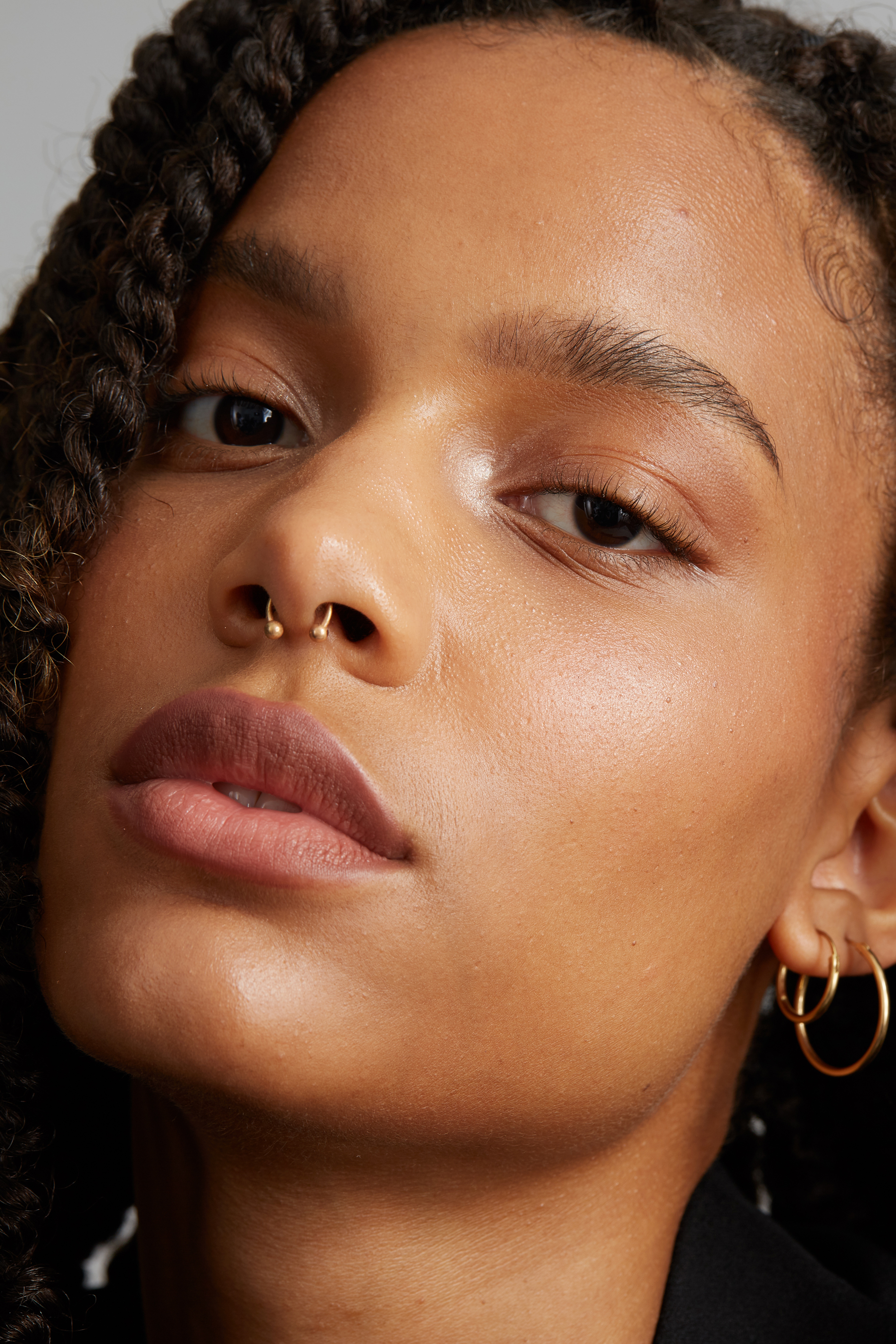 Close-up beauty portrait before retouching, with natural skin texture and neutral makeup