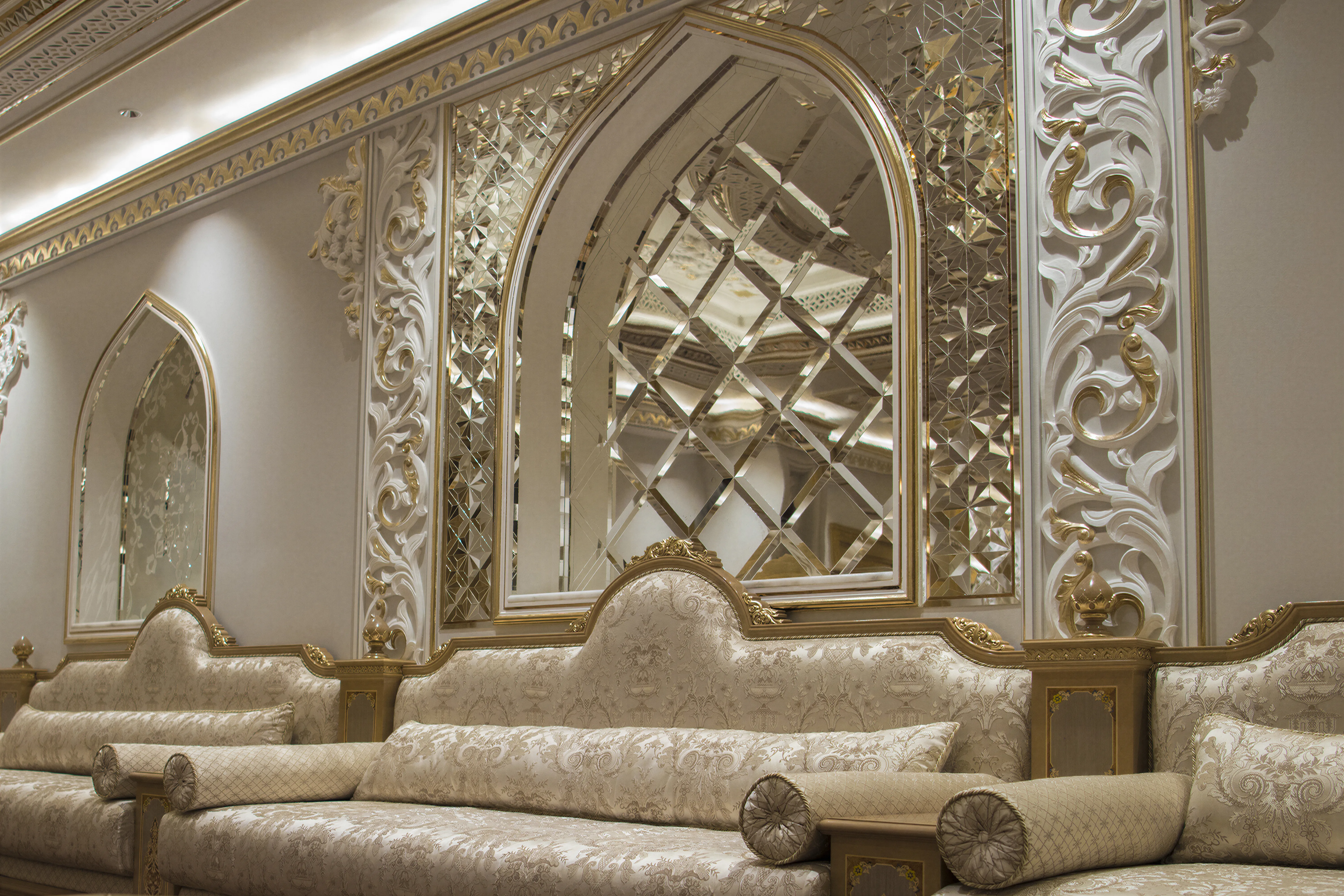 Luxury home interior, with custom furniture and glasswork. Platinum finishes and custom carving details.