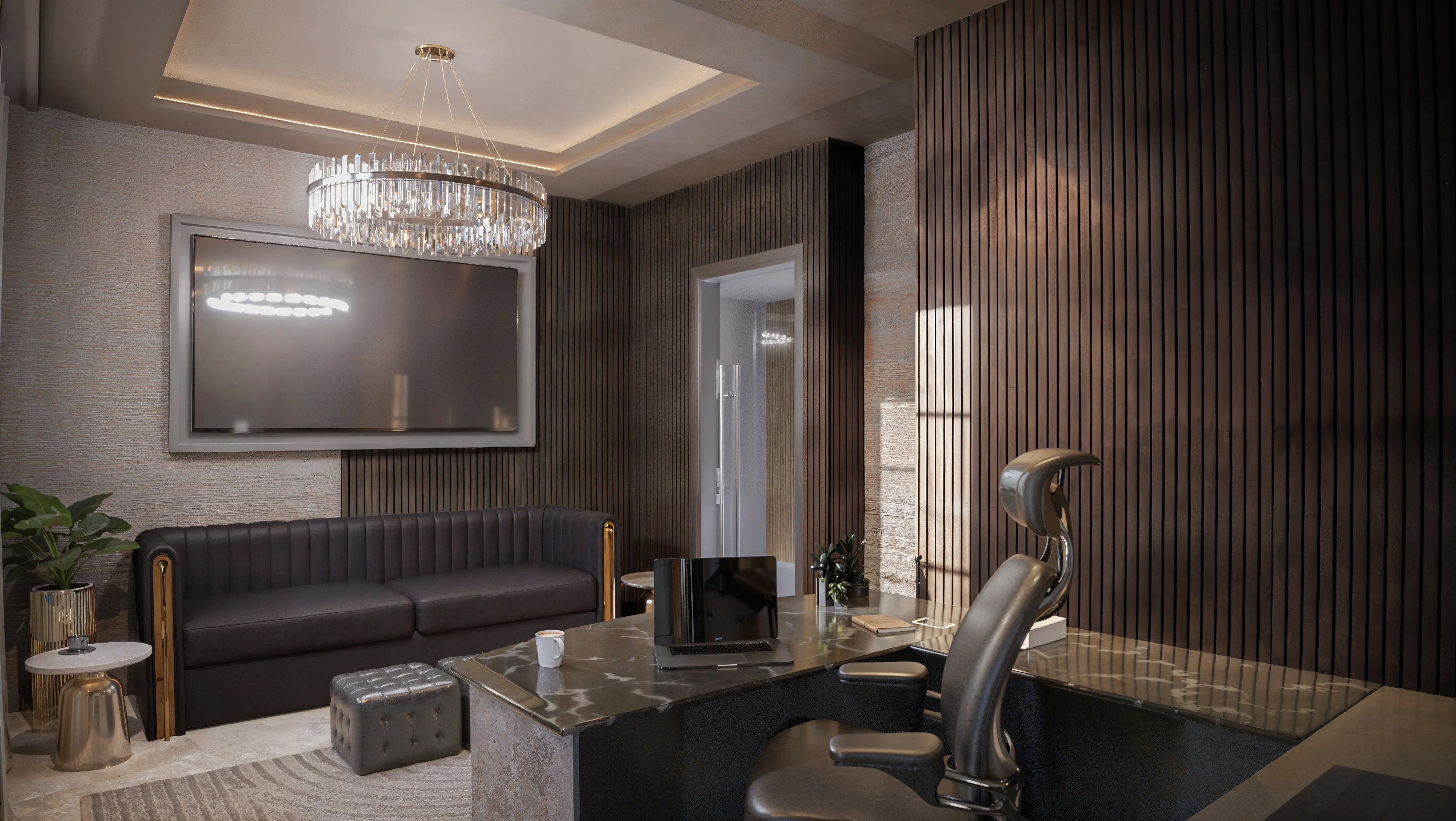Luxury executive office with dark brown wood panels and a recessed TV across the room. Custom desk with a stone top and a black leather sofa with gold trim. The floor is polished concrete with a dimensional throw carpet. Recessed ceiling and cove lighting with a modern chandelier. 