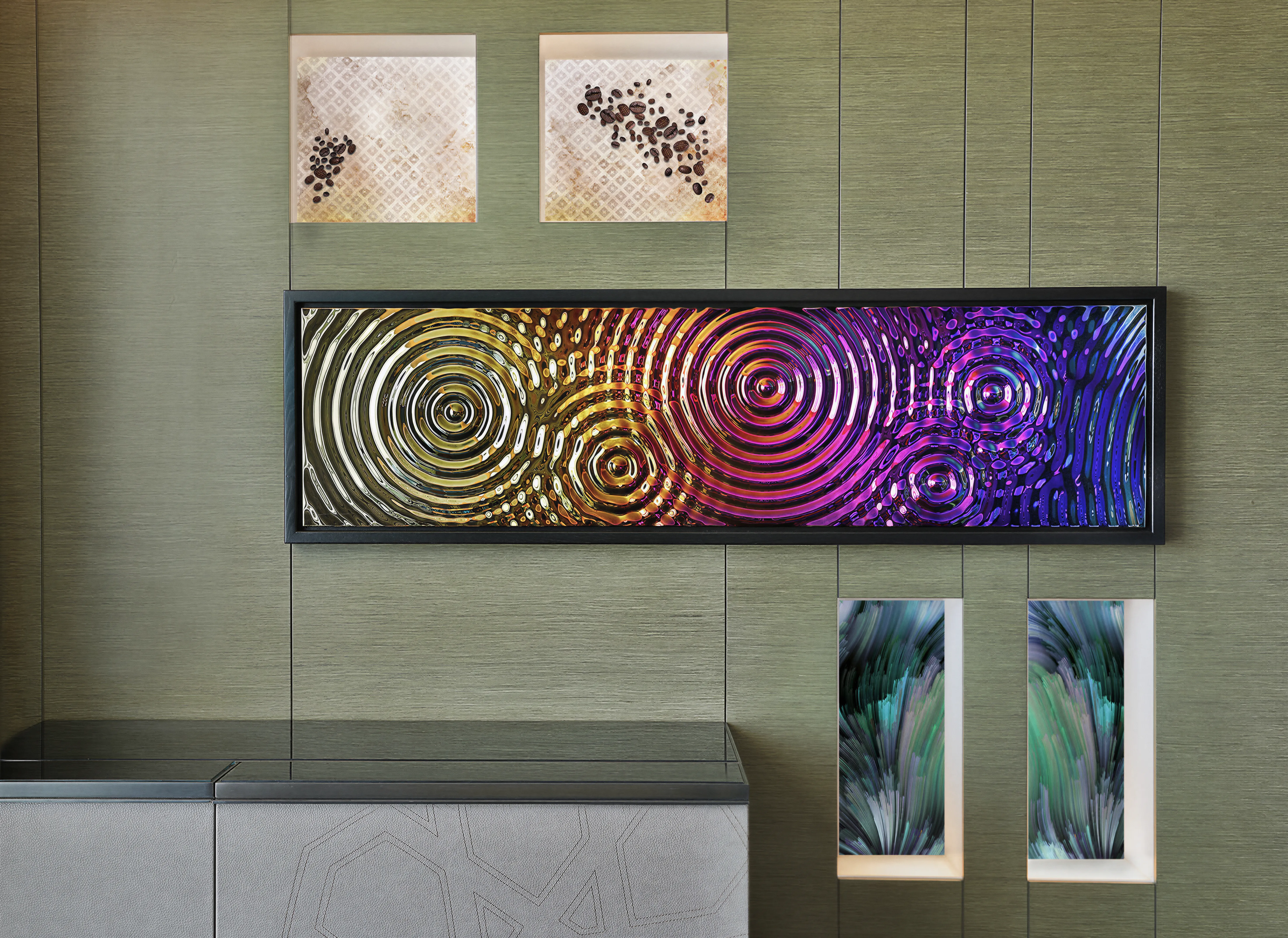 Hotel bedroom’s feature wall, featuring lenicualr interactive art and multicolor 3d glass. On a green textured wallpaper. And a stitched console. 