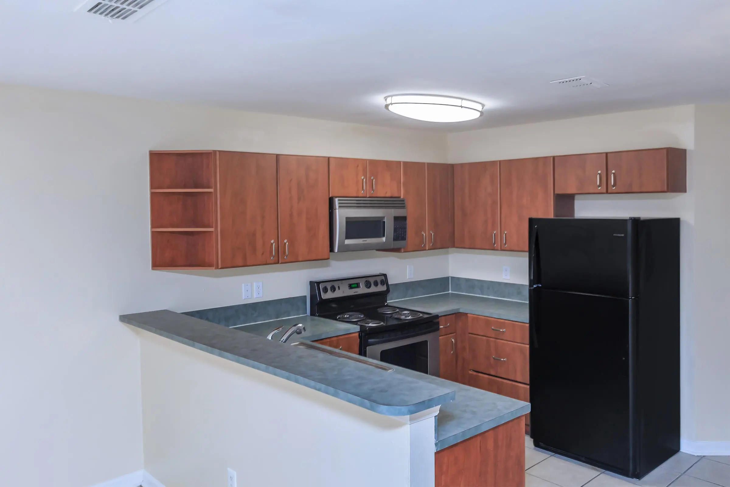 Kitchen with brown cabinets