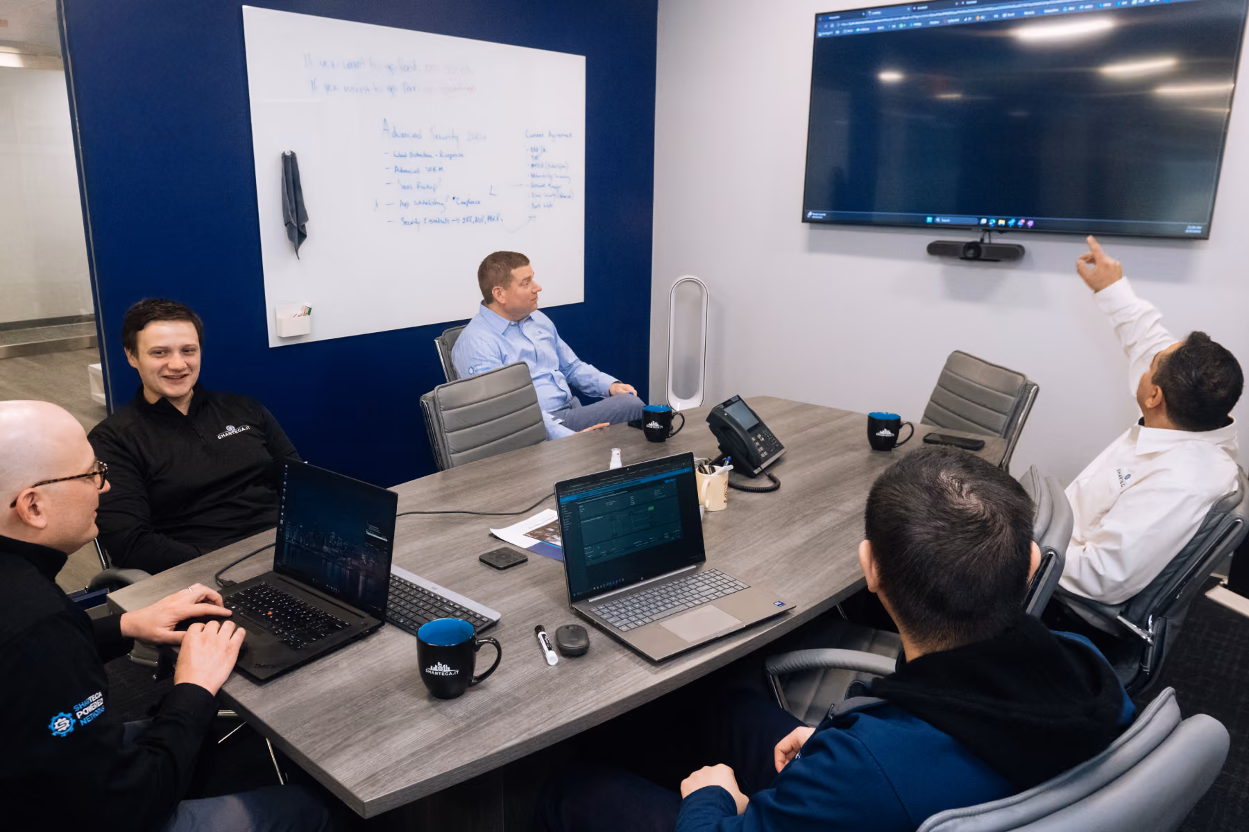 Shartega IT team meeting in the conference room
