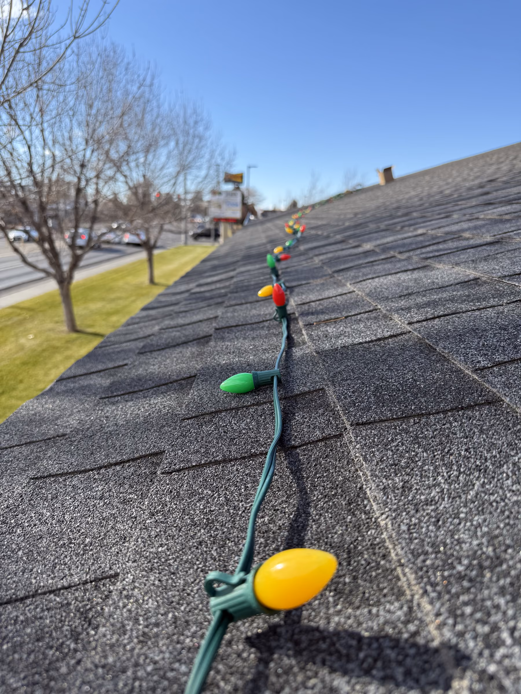 Commercial roofline holiday lighting installed by Wake Window Cleaning in Idaho Falls