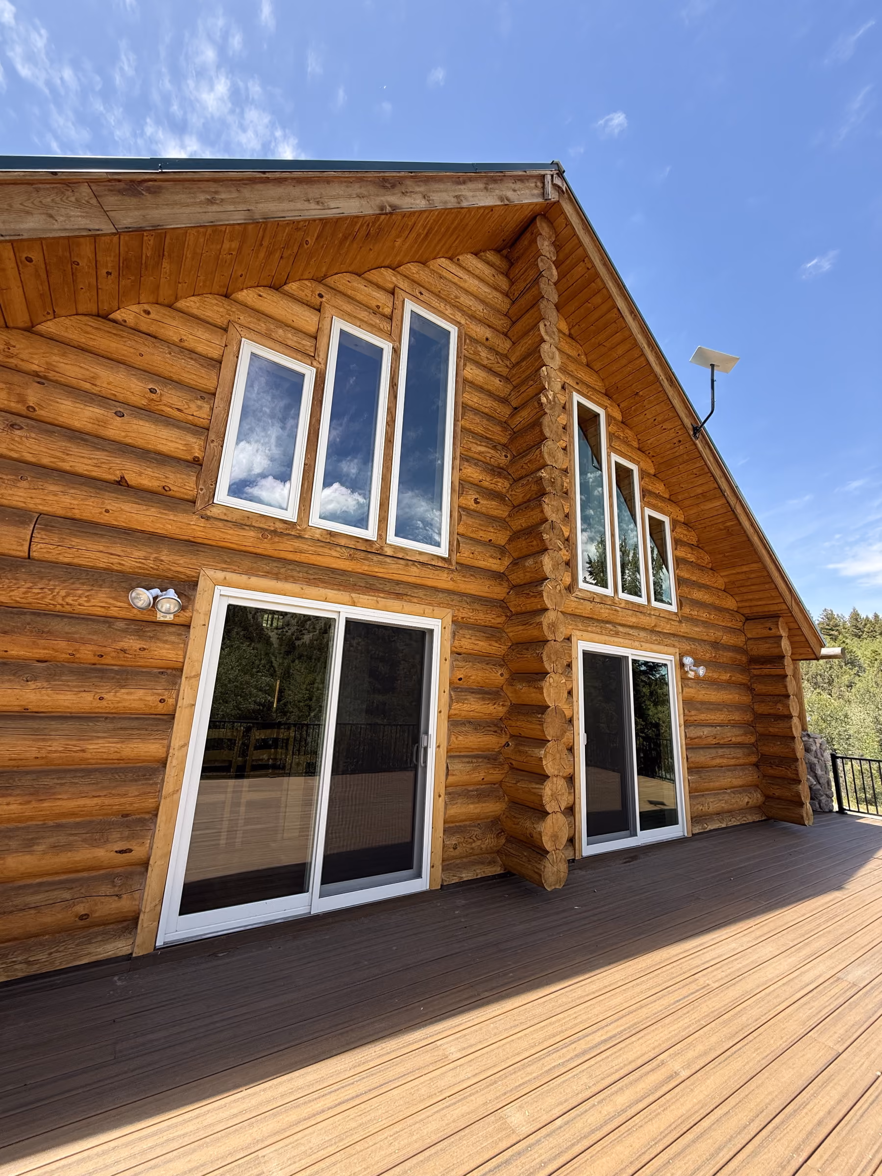 Exterior window cleaning on a log cabin home in Teton County, Idaho