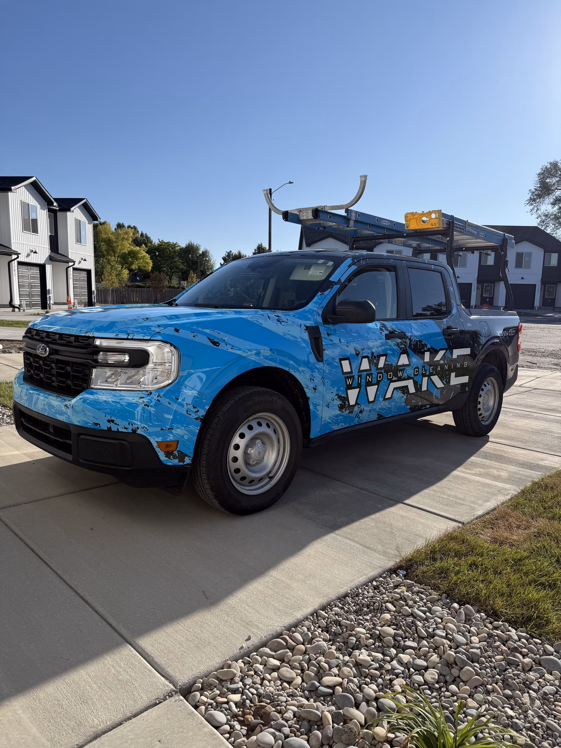 Wake Window Cleaning truck in a Bannock County residential neighborhood