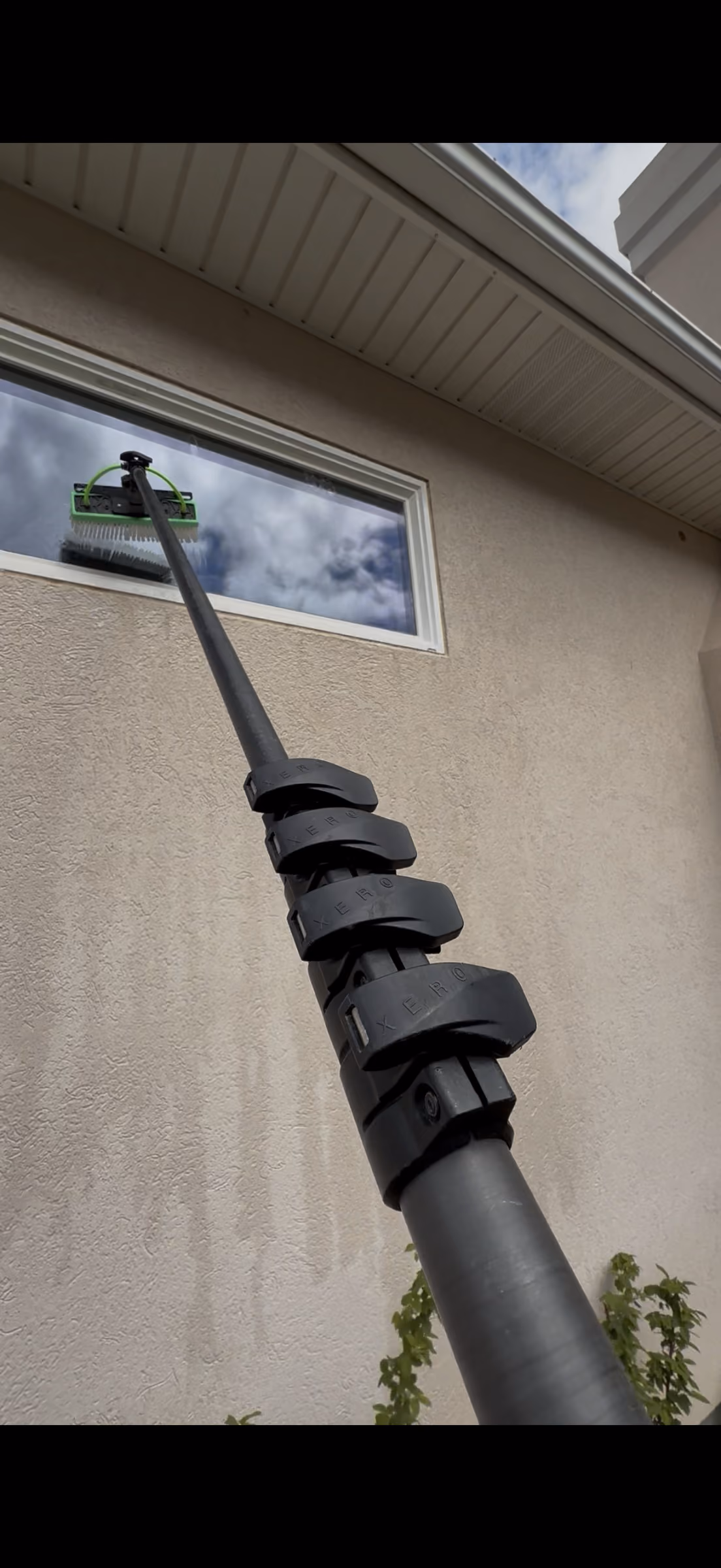 Water-fed pole window cleaning at a Rigby home