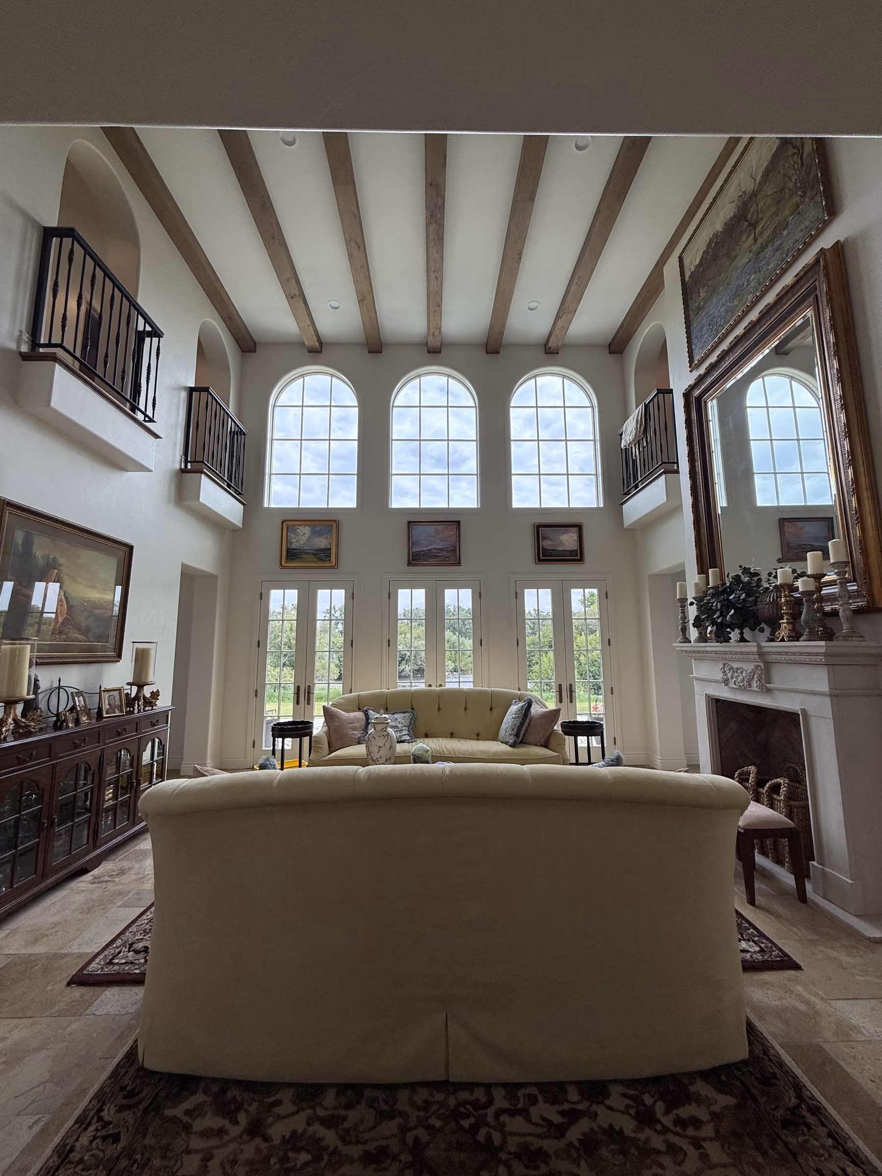 Bright new-construction great room with streak-free arched windows