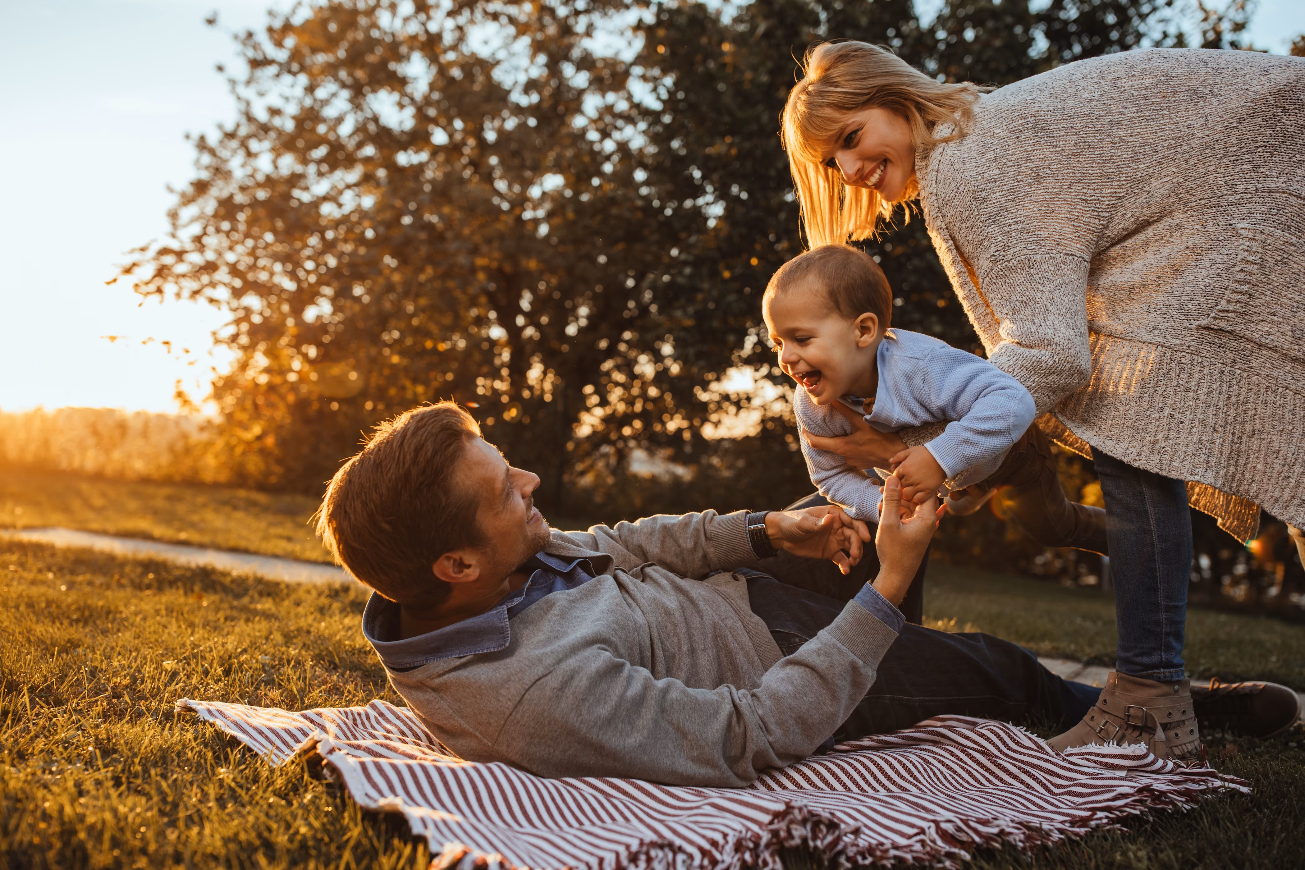 Family sitting intged park stock image