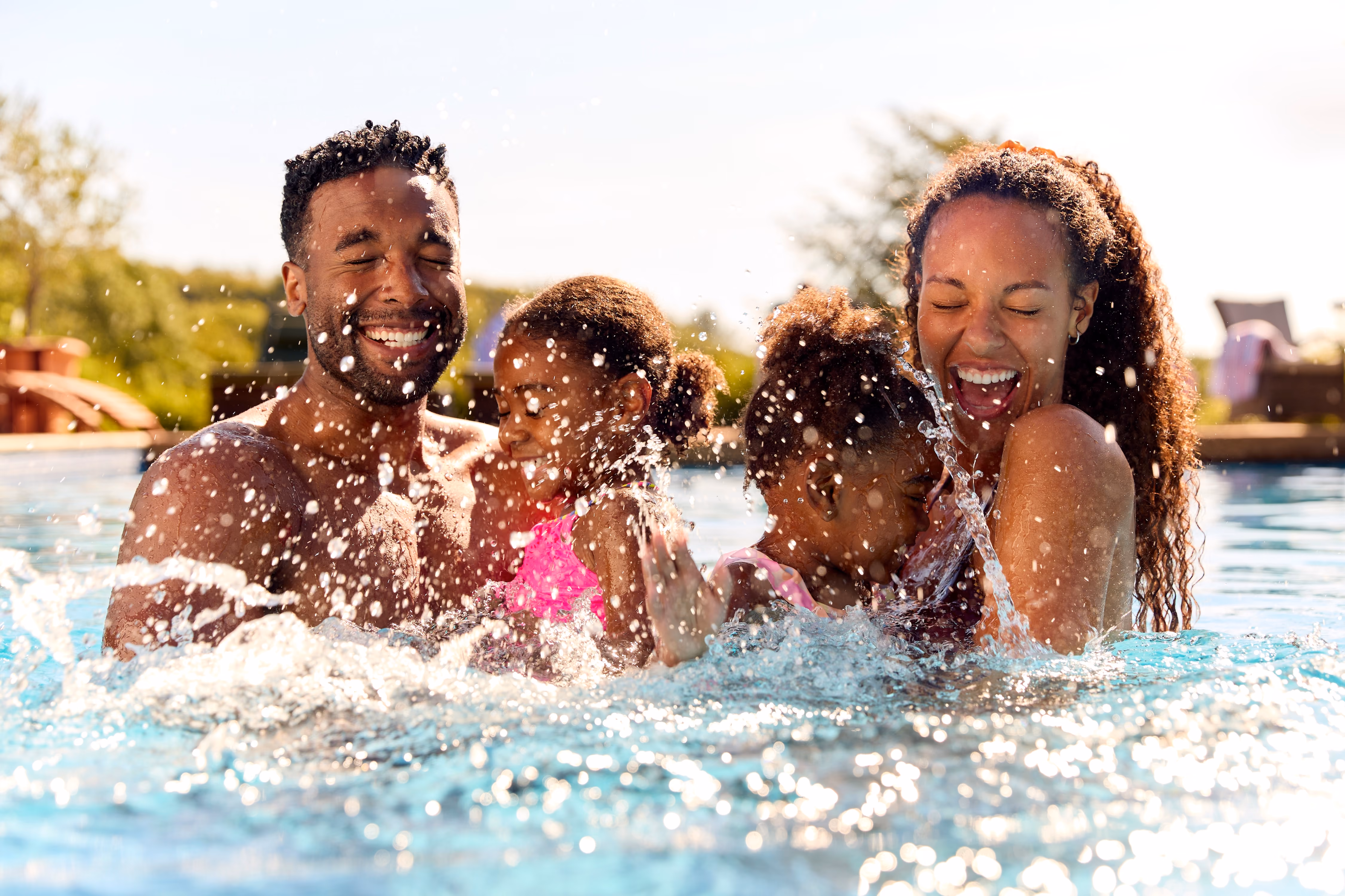 Family in the pool stock image