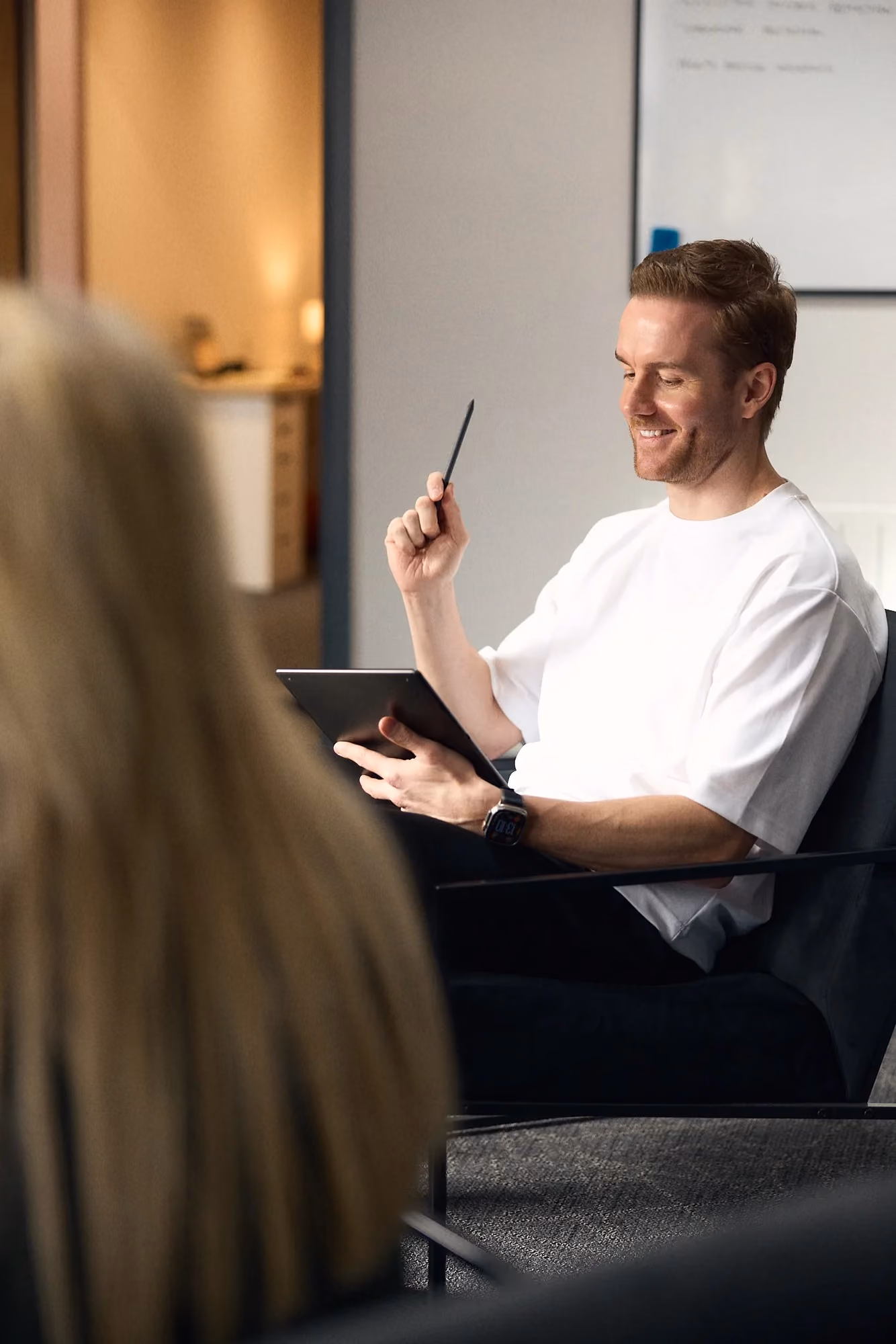 lawrecne heard sat in a chair telling the team about key person insurance