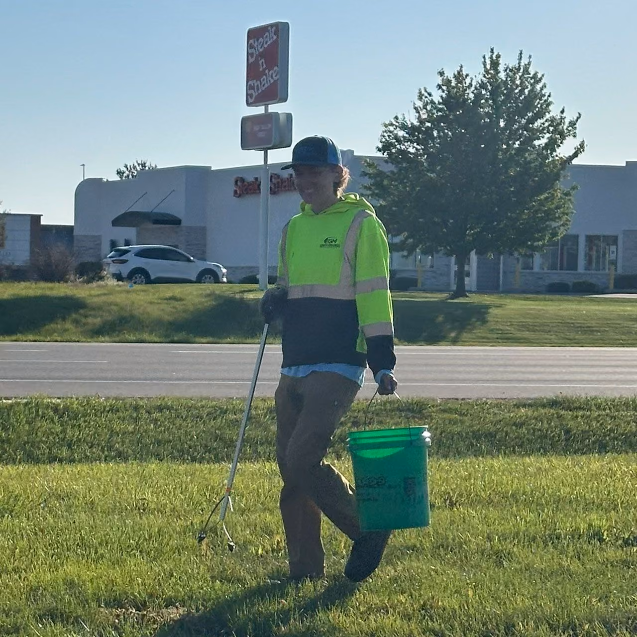 Easier Grounds Management team member providing professional lawn care in Pekin, Illinois