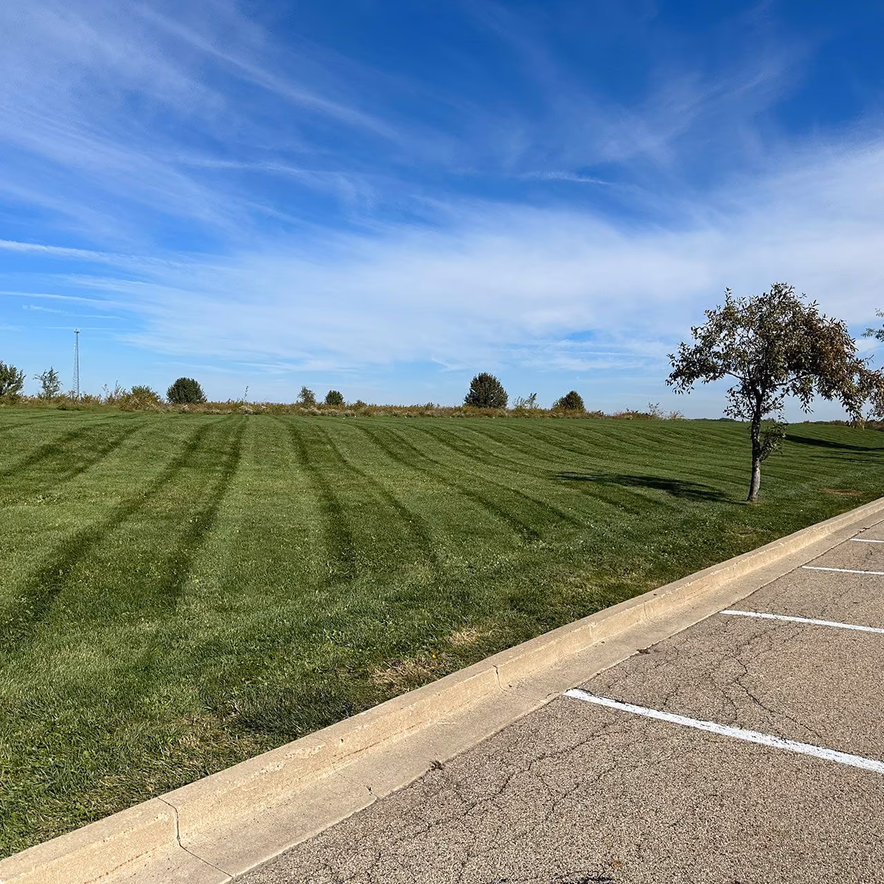 Professional lawn maintenance by Easier Grounds Management in Pekin, Illinois