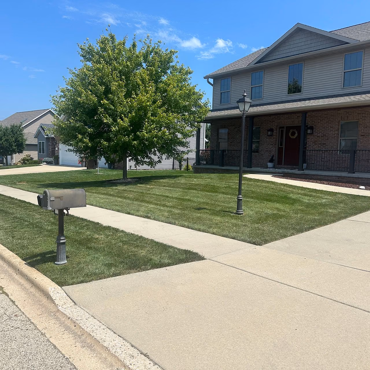 Residential lawn care and maintenance by Easier Grounds Management in Pekin, Illinois