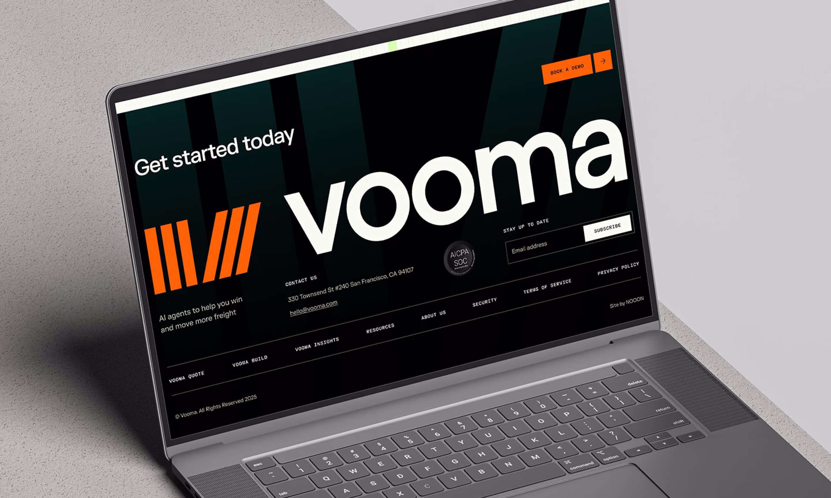 Laptop displaying the Vooma site footer with a large wordmark, orange logo, and Get started today heading.