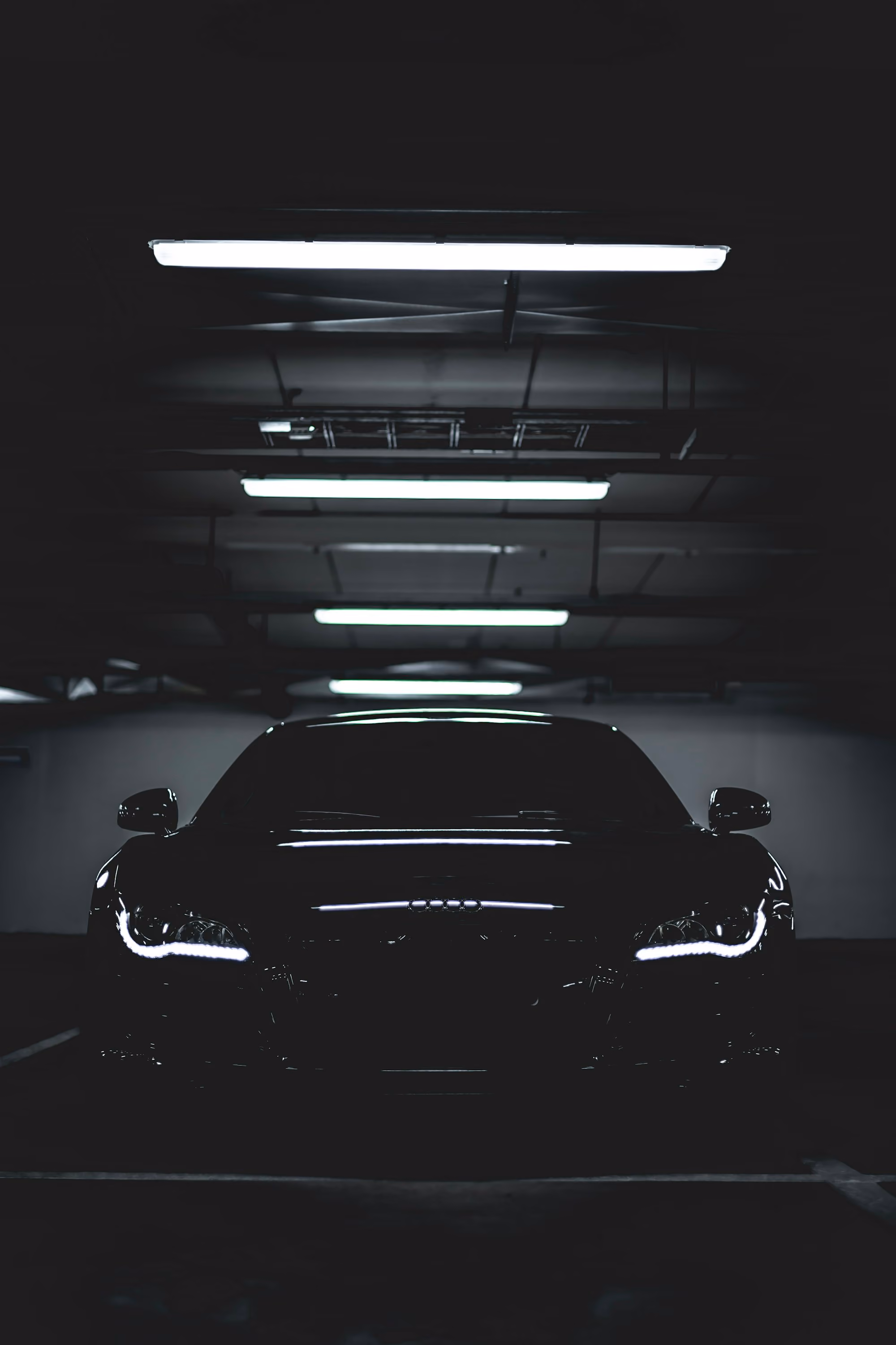 Car being detailed in a professional detailing bay