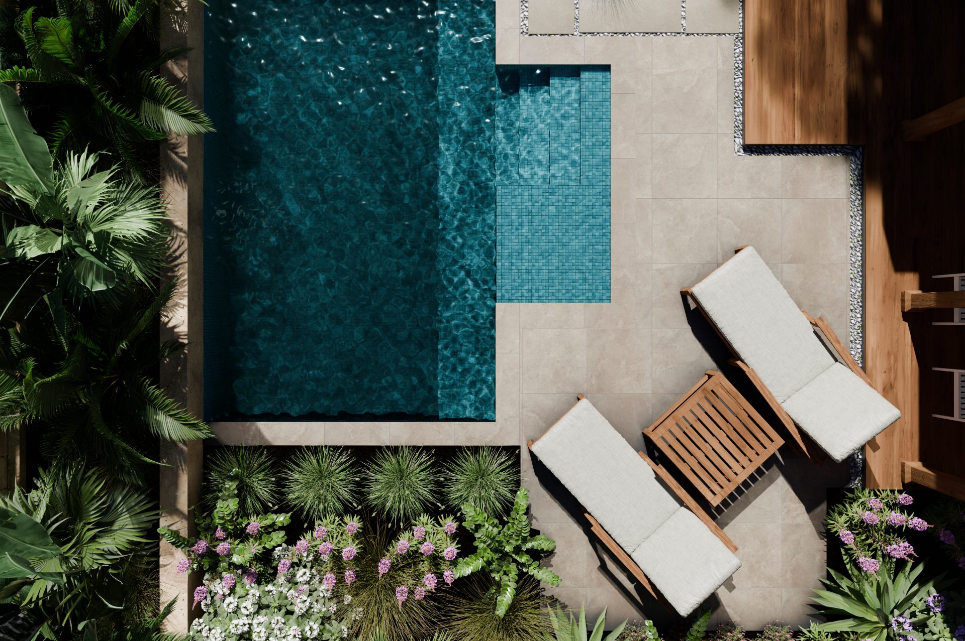 Hotel pool deck with lounge chairs and tropical plants